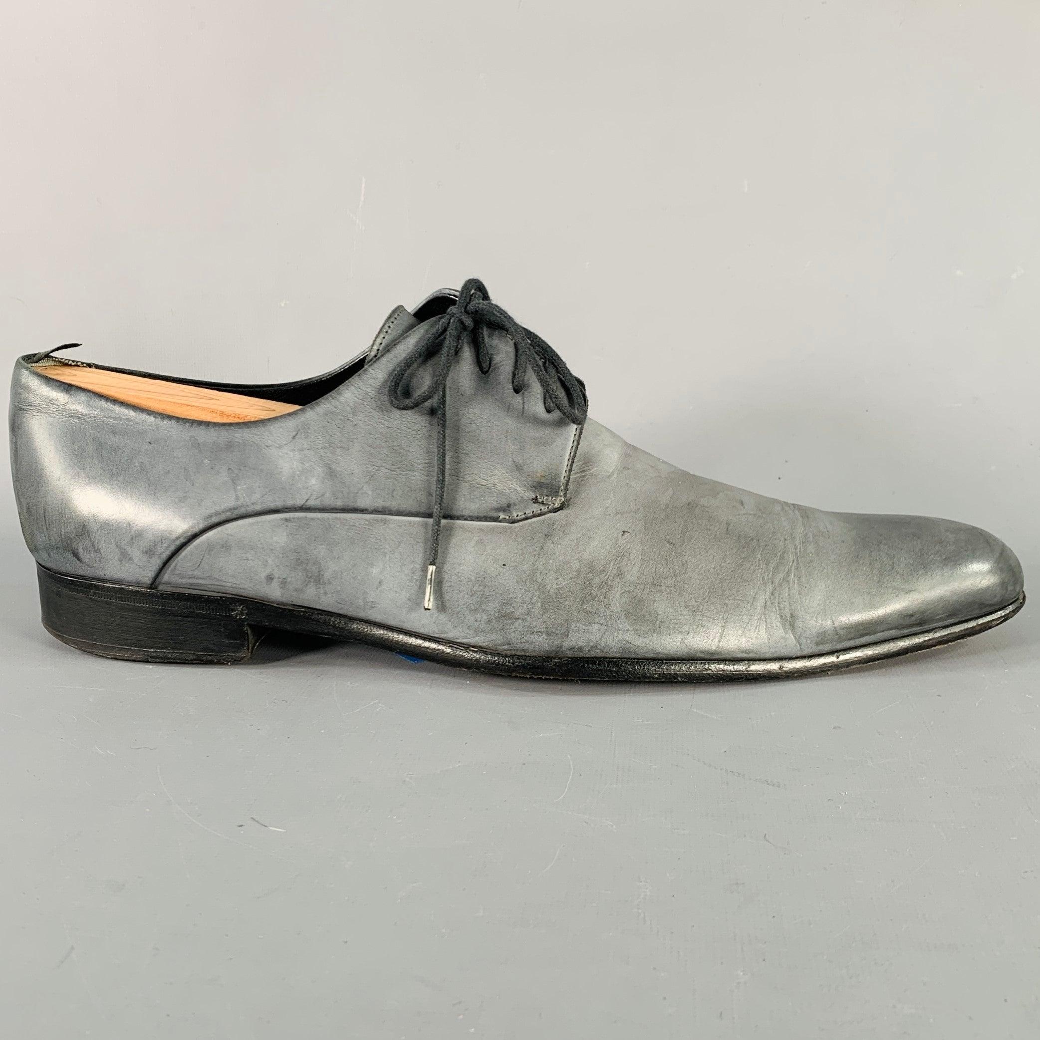 DOLCE & GABBANA derby shoes
in a grey leather featuring almond toe and lace-up closure. Made in Italy.Good Pre-Owned Condition. Moderate signs of wear on soles, and moderate marks. As is. 

Marked:   2915 10.5Outsole: 12.75 inches  x 4 inches 
  
 