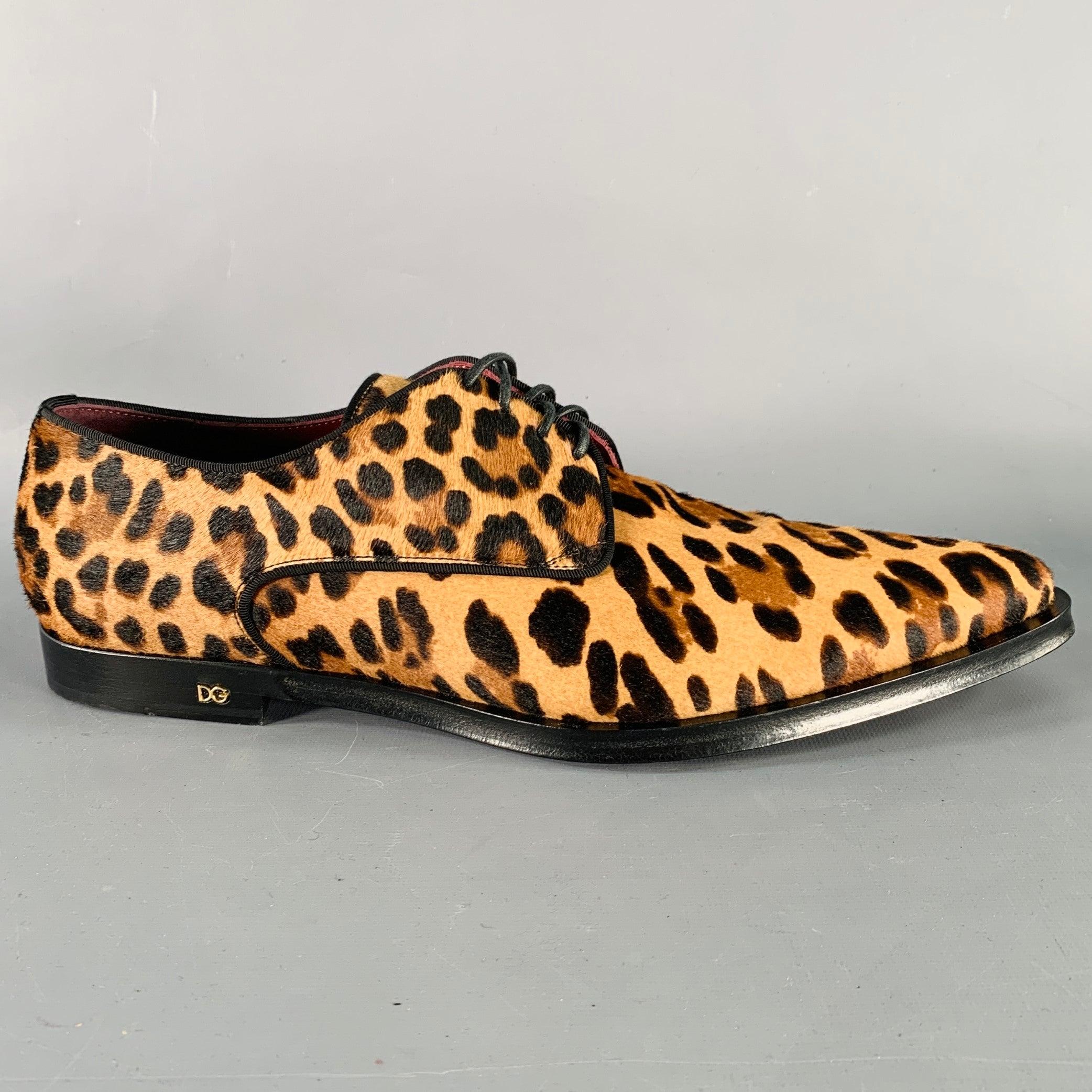 DOLCE & GABBANA derby shoes
in a tan, brown, and black pony hair featuring an all over animal print, grosgrain trim, pointed toe, and lace-up closure. Comes with box. Made in Italy.Excellent Pre-Owned Condition with Box. 

Marked:  
A10470