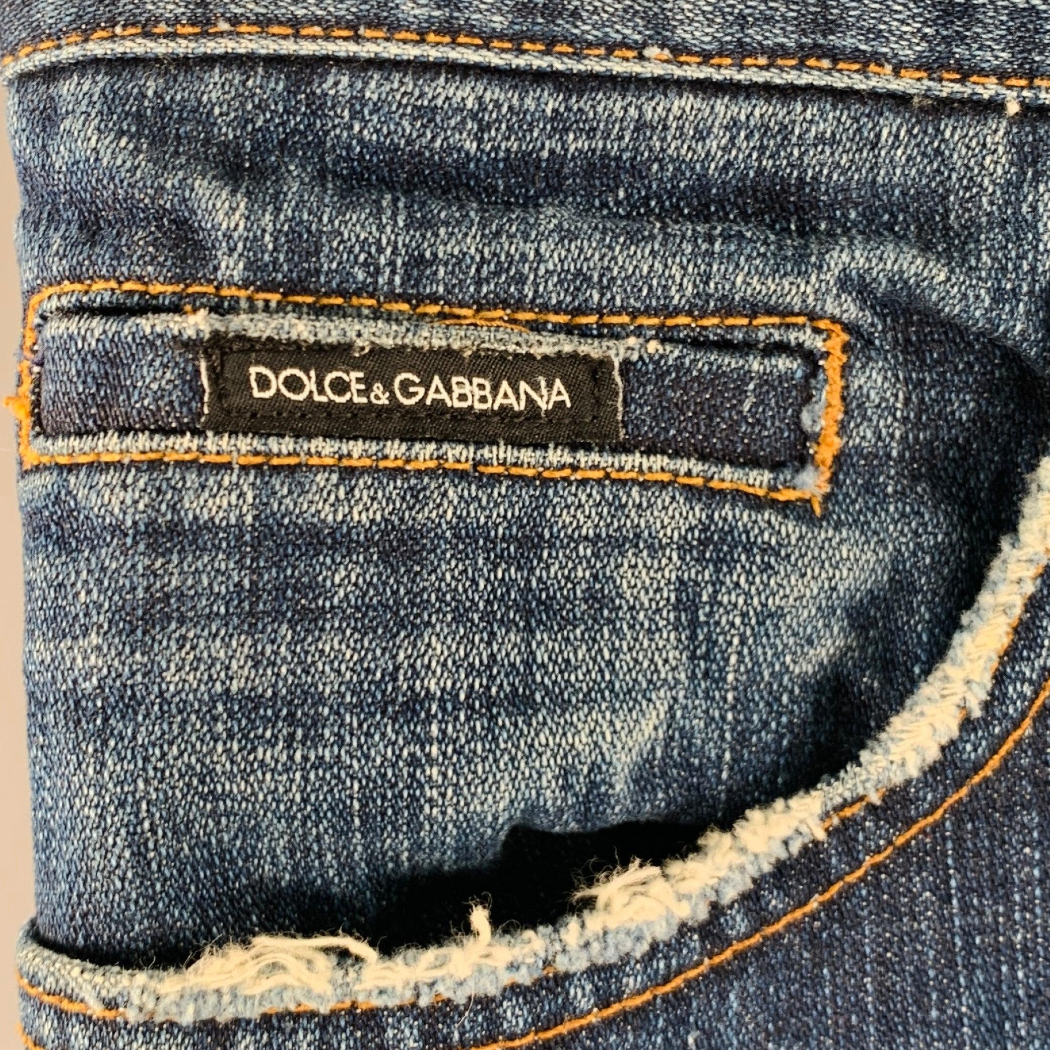 DOLCE & GABBANA jeans in a blue cotton woven fabric featuring a five pockets style, contrast stitching, and zip fly closure. Made in Italy.Excellent Pre-Owned Condition. 

Marked:   IT 44 

Measurements: 
  Waist: 28 inches Rise: 7.5 inches Inseam:
