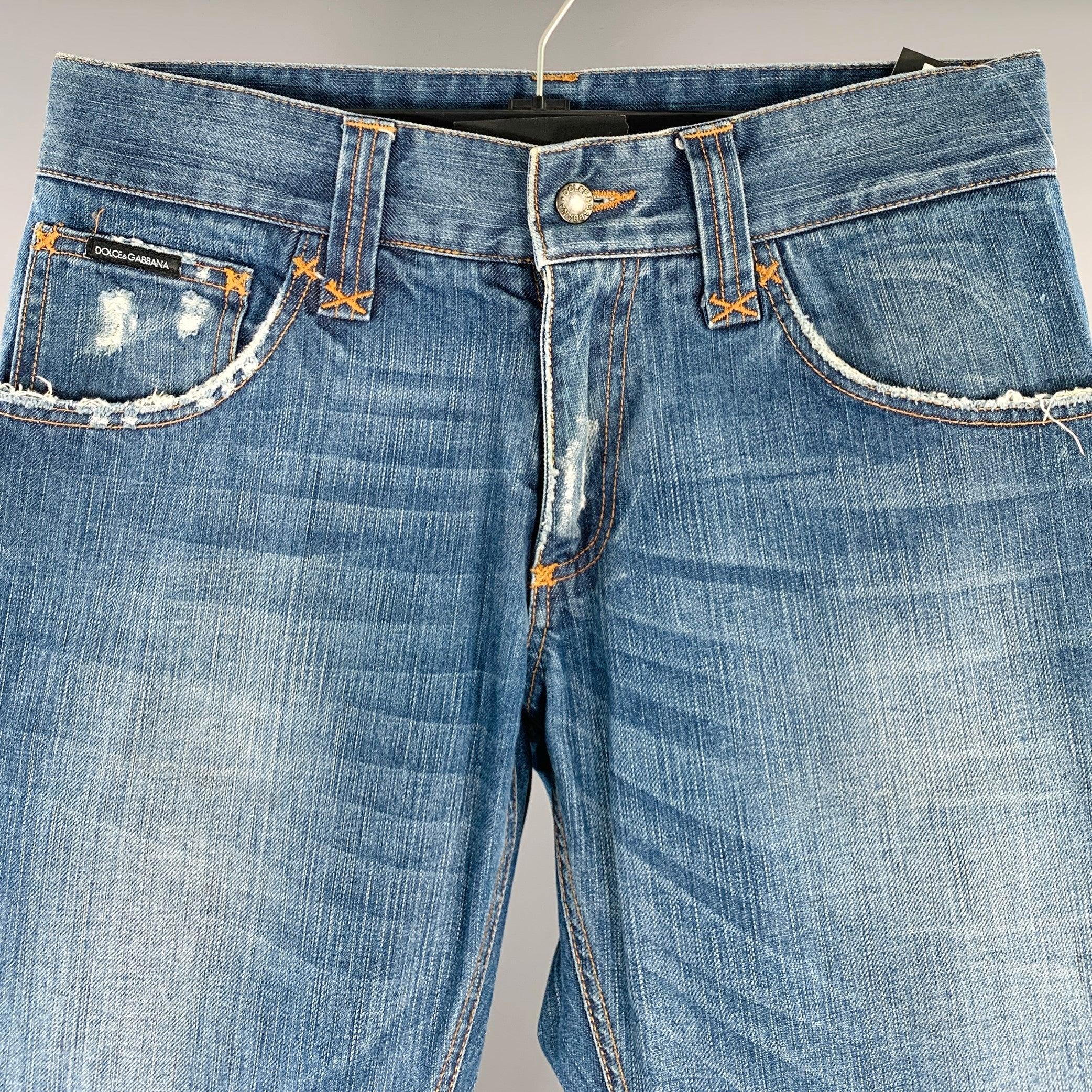 DOLCE & GABBANA jeans
in a blue cotton woven fabric featuring a distressed style, straight leg, and zip fly closure. Made in Italy.Excellent Pre-Owned Condition. 

Marked:   IT 44 

Measurements: 
  Waist: 28 inches Rise: 7.5 inches Inseam: 32