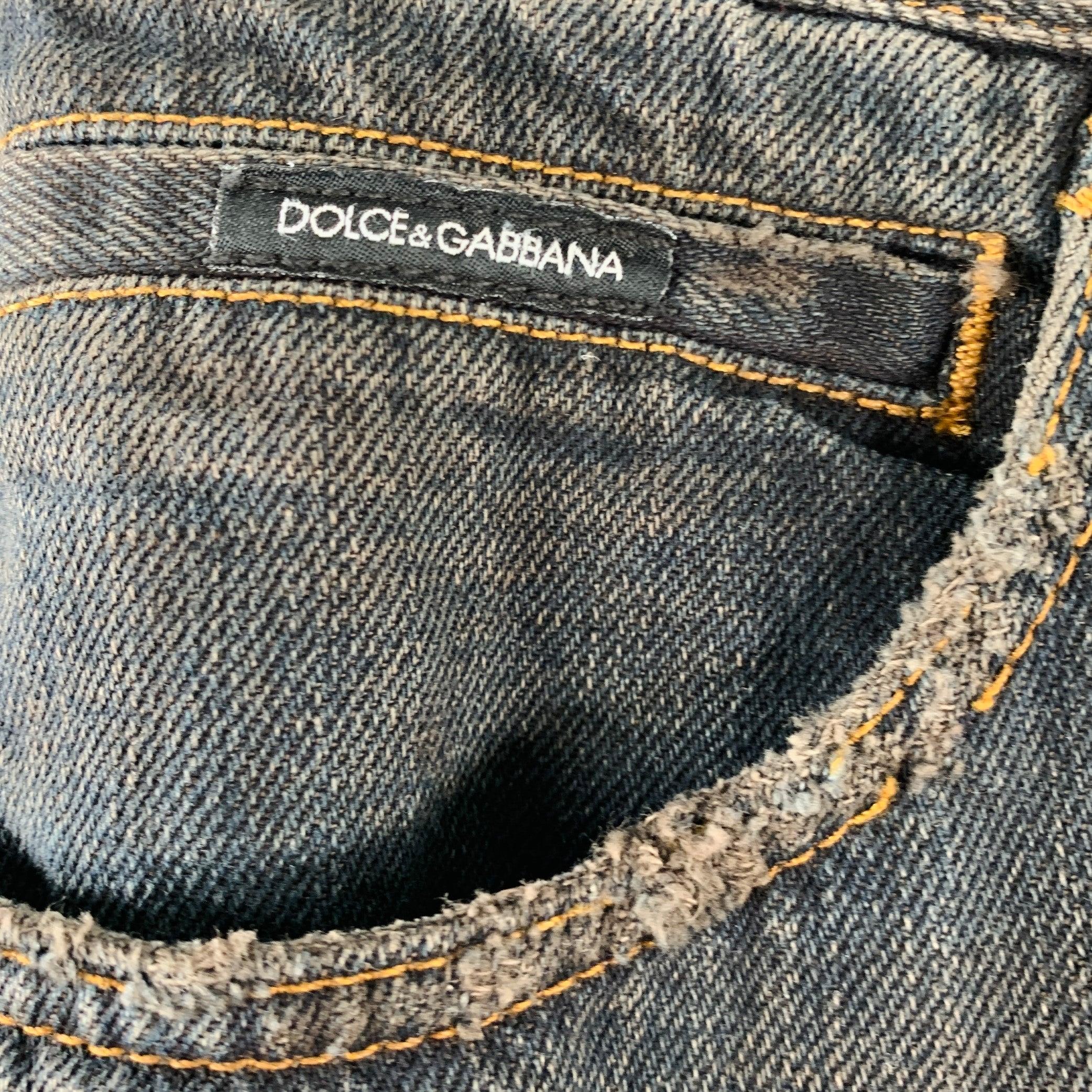 DOLCE & GABBANA jeans in a grey cotton woven fabric featuring a five pockets style, brown contrast stitching, and zip fly closure. Made in Italy.Excellent Pre-Owned Condition. 

Marked:   IT 44 

Measurements: 
  Waist: 28 inches Rise: 7.5 inches