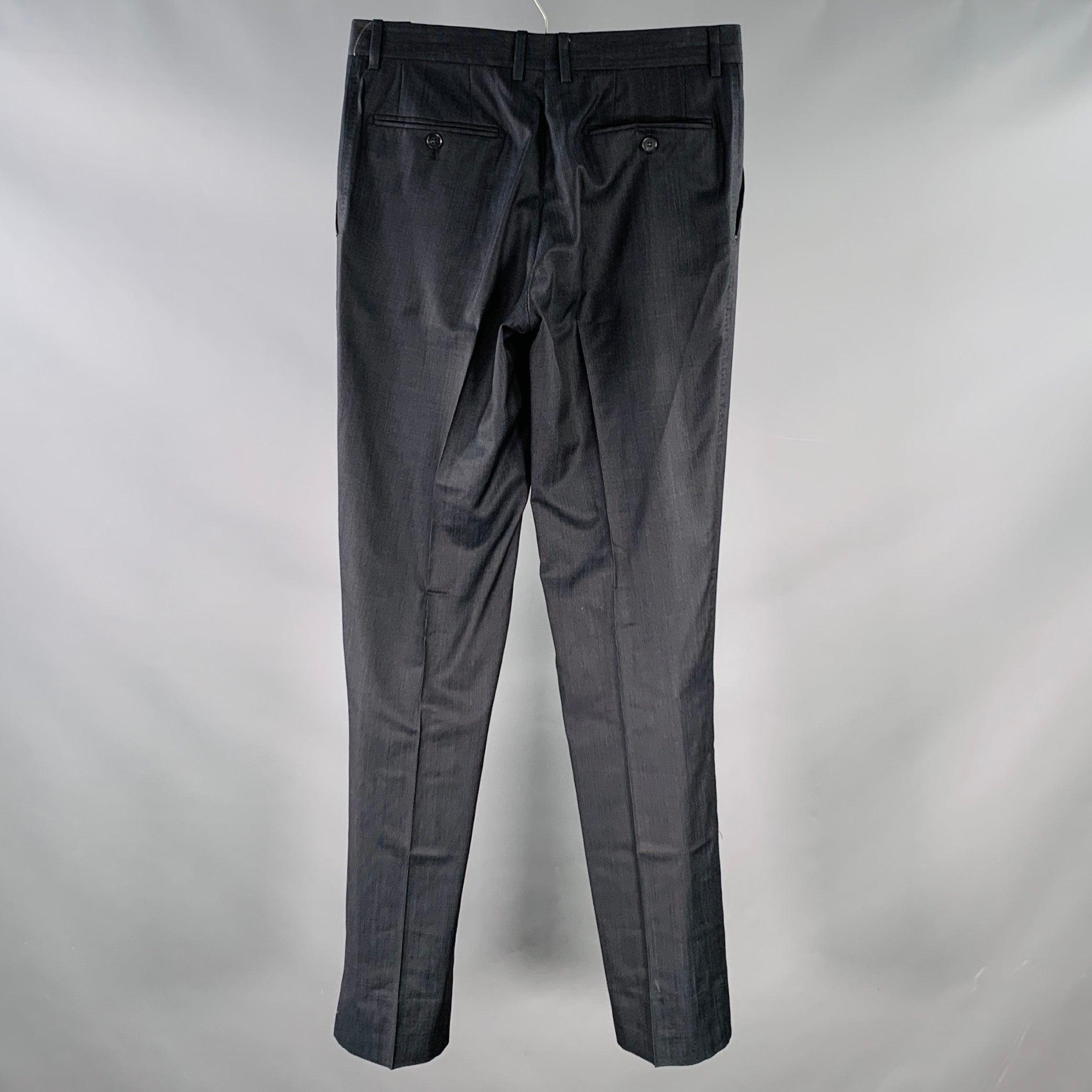 DOLCE & GABBANA dress pants
in a black and navy virgin wool silk blend fabric featuring an all over dots pattern, tapered leg, and zip fly closure. Made in Italy.Excellent Pre-Owned Condition.  

Marked:   IT 46 

Measurements: 
  Waist: 30 inches