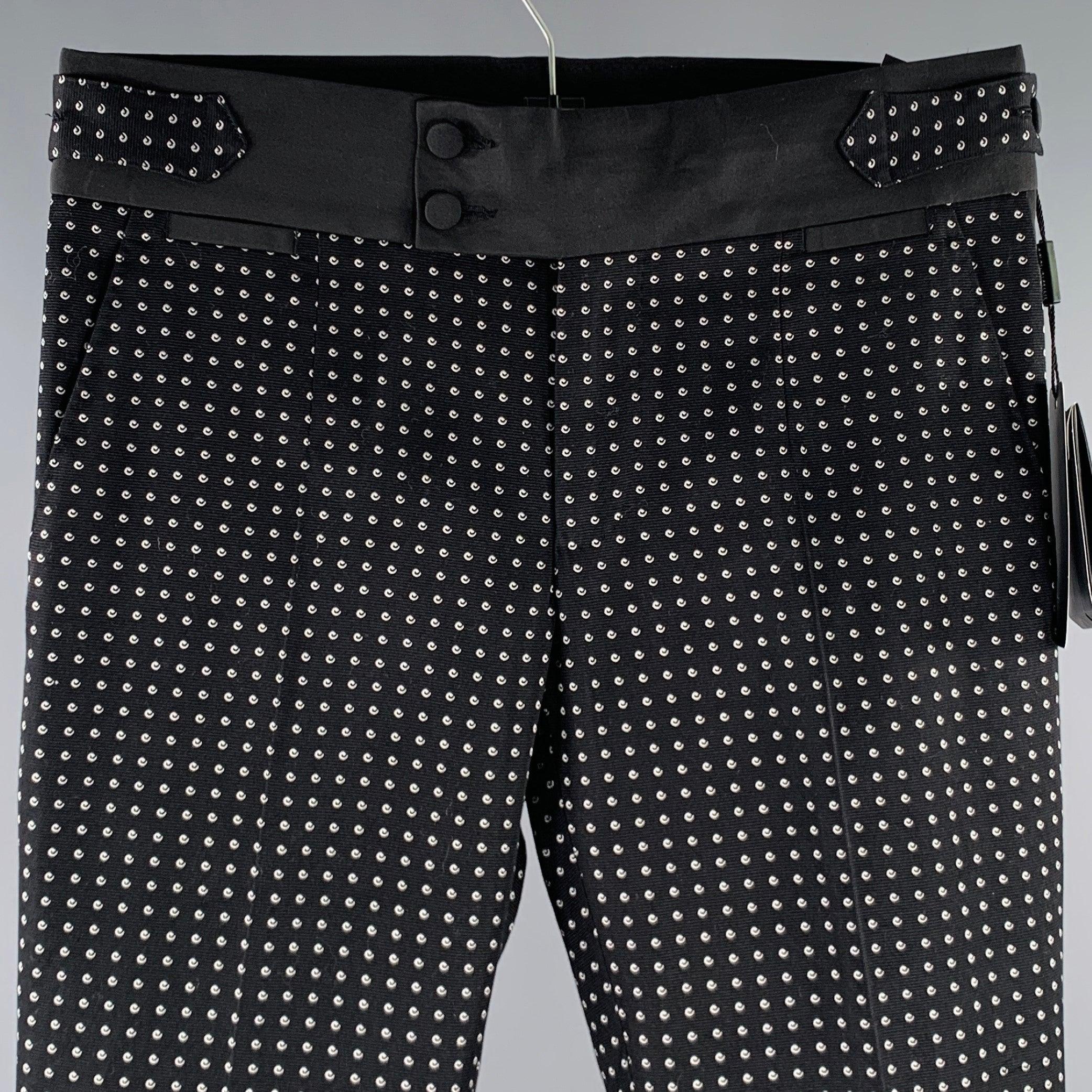 DOLCE & GABBANA dress pants
in a black and white cotton blend fabric featuring a dots pattern, flat front style, tuxedo side stripes, and zip fly closure. Made in Italy.New with Tags. 

Marked:   IT 44 

Measurements: 
  Waist: 30 inches Rise: 9