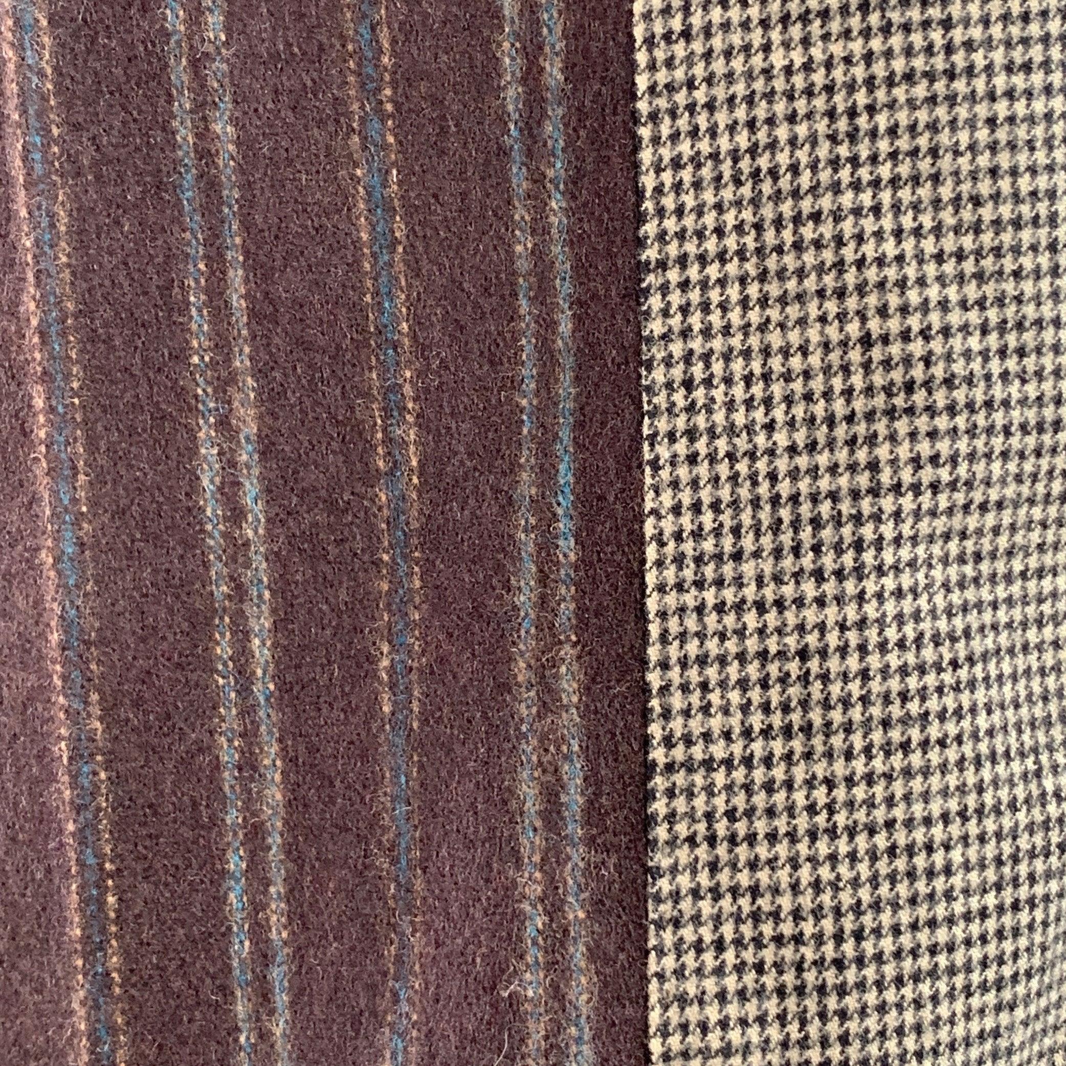 Pantalon habillé DOLCE & GABBANA
en laine mélangée marron et grise à motifs mixtes (rayures marron et pied-de-poule gris), jambe fuselée et fermeture à glissière. Fabriqué en Italie. Nouveau avec étiquettes. 

Marqué :   IT 48 

Mesures : 
  Taille