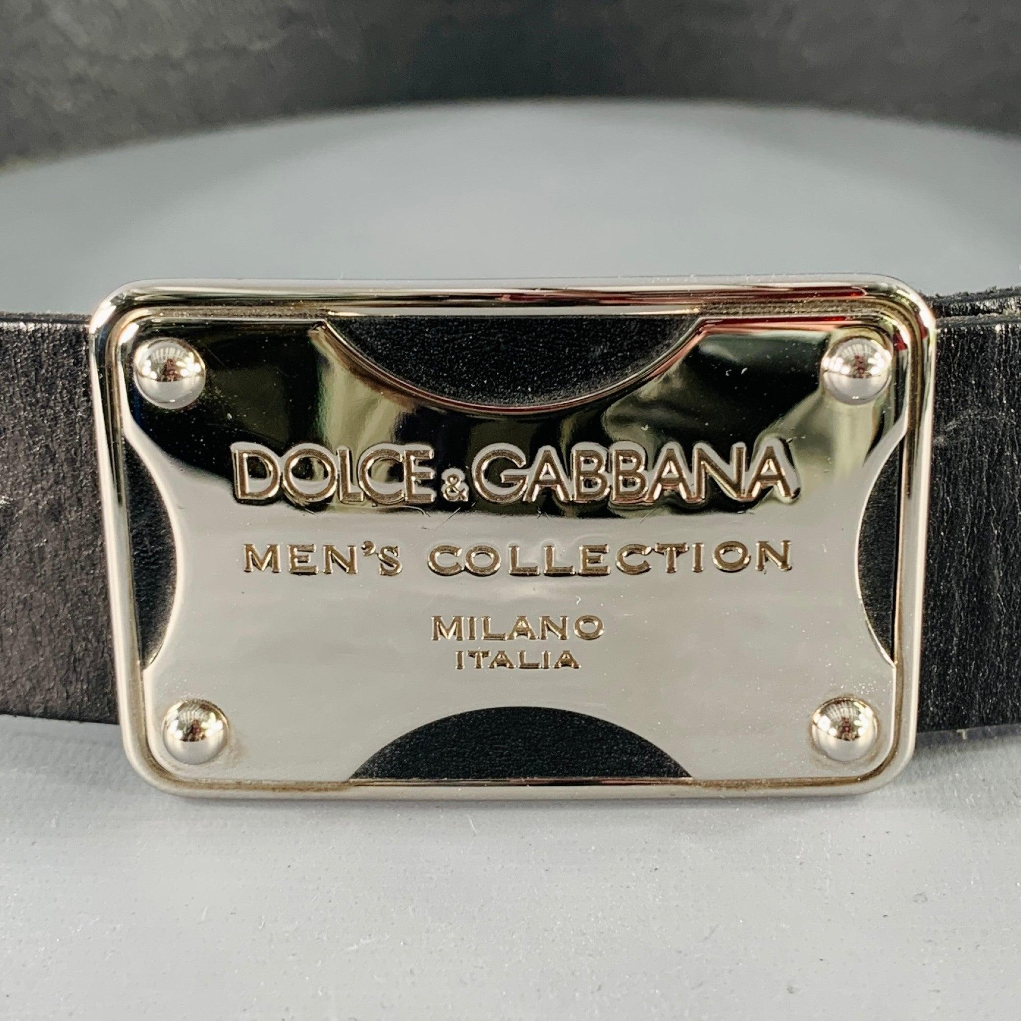 DOLCE & GABBANA belt
in a black leather featuring a rectangular silver tone metal buckle with debossed MEN'S COLLECTION logo. Made in Italy.Excellent Pre-Owned Condition. 

Marked:   BC2369Length: 37.5 inches Width: 1.5 inches Fits: 30 inches  - 34