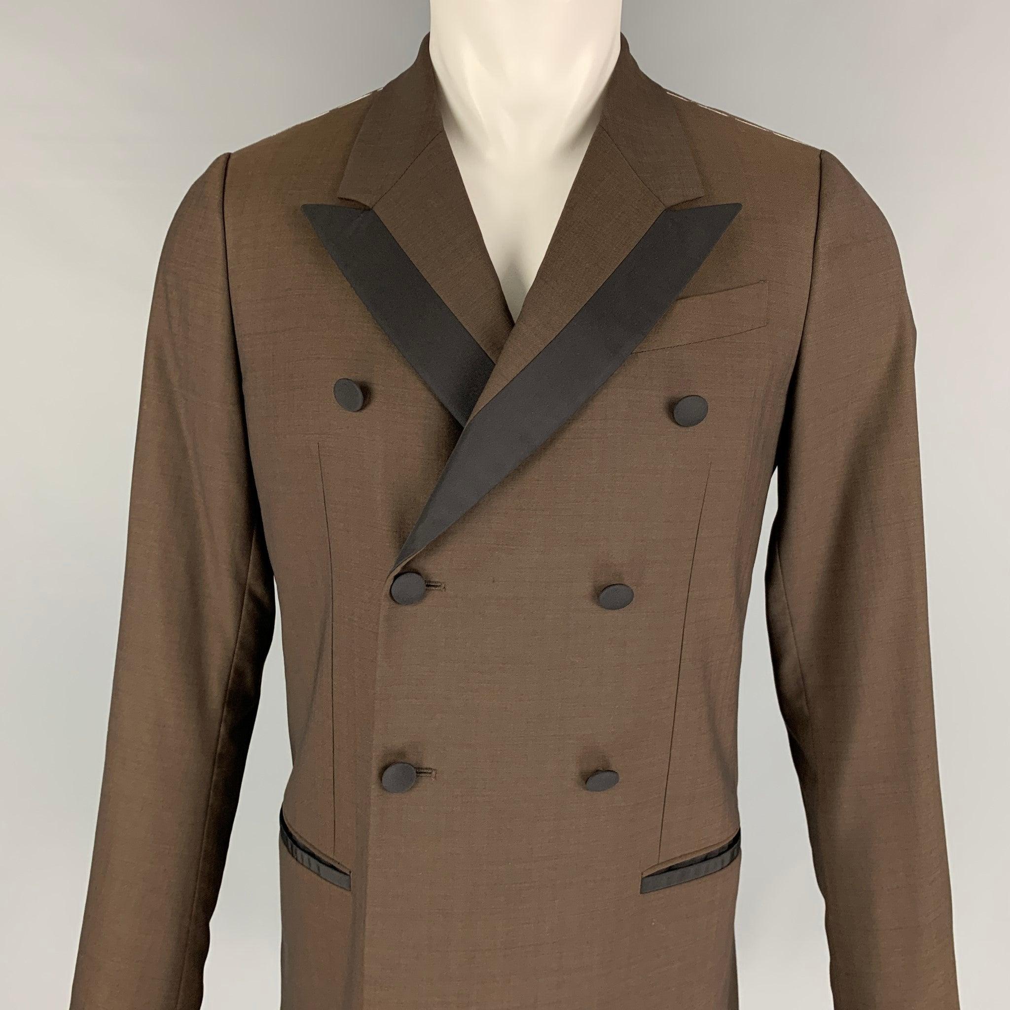 DOLCE & GABBANA coat comes in a brown & black wool blend with a full liner featuring a peak lapel, slit pockets, single back vent, and a double breasted closure. Made in Italy.
Excellent
Pre-Owned Condition. 

Marked:   44 

Measurements: 
