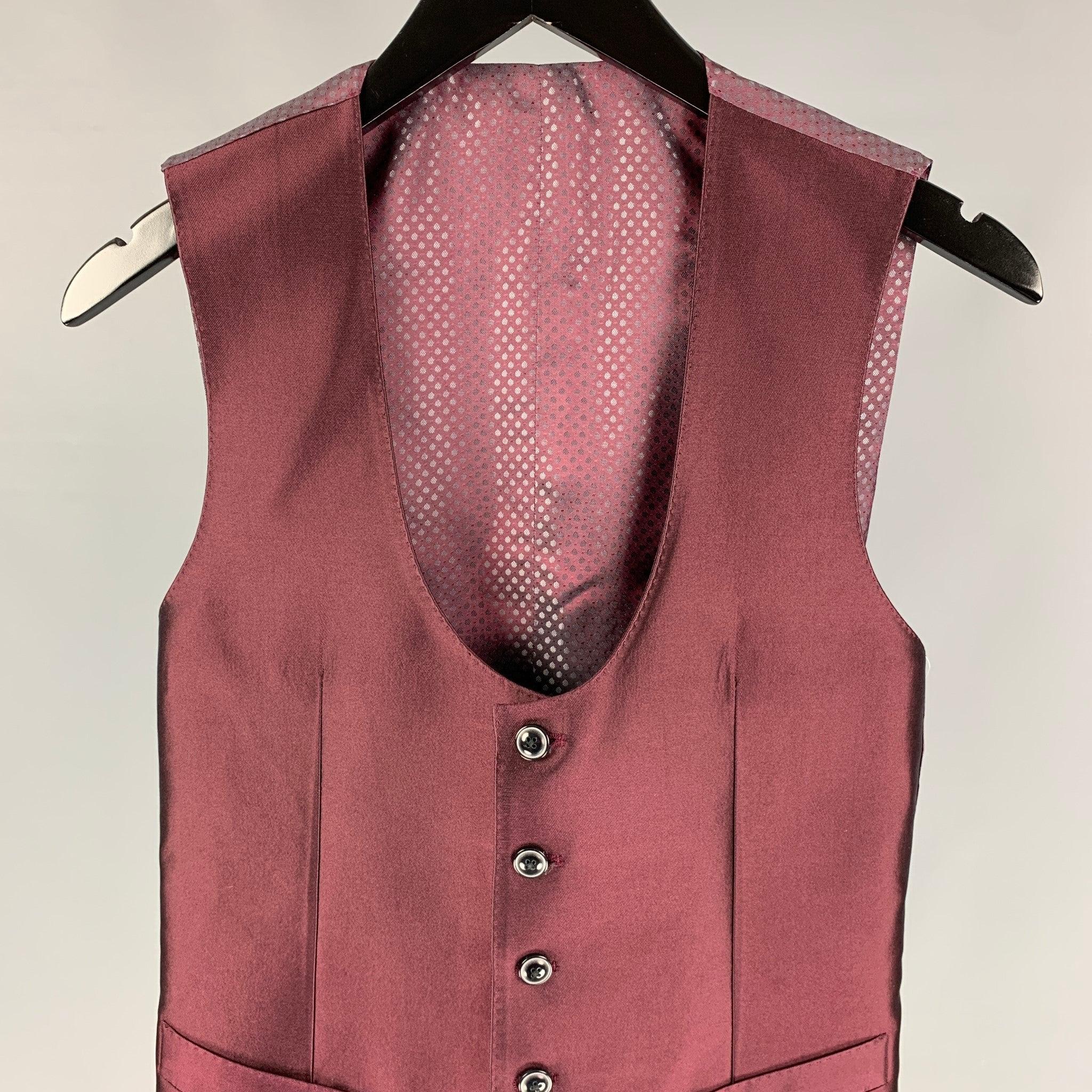DOLCE & GABBANA dress vest comes in a burgundy silk featuring a back belt, front pockets, and a buttoned closure. Made in Italy.
Excellent
Pre-Owned Condition. 

Marked:   44 

Measurements: 
 
Shoulder: 13 inches Chest: 34 inches  Length: 22 inches