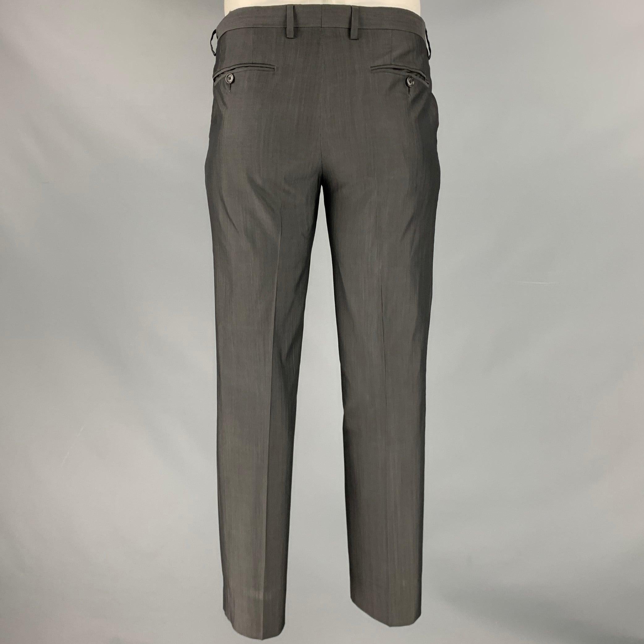 DOLCE & GABBANA dress pants
in a grey wool silk blend fabric featuring a flat front style, and zip fly closure. Made in Italy.Excellent Pre-Owned Condition. 

Marked:   50 

Measurements: 
  Waist: 34 inches Rise: 8.5 inches Inseam: 29 inches 
  
 