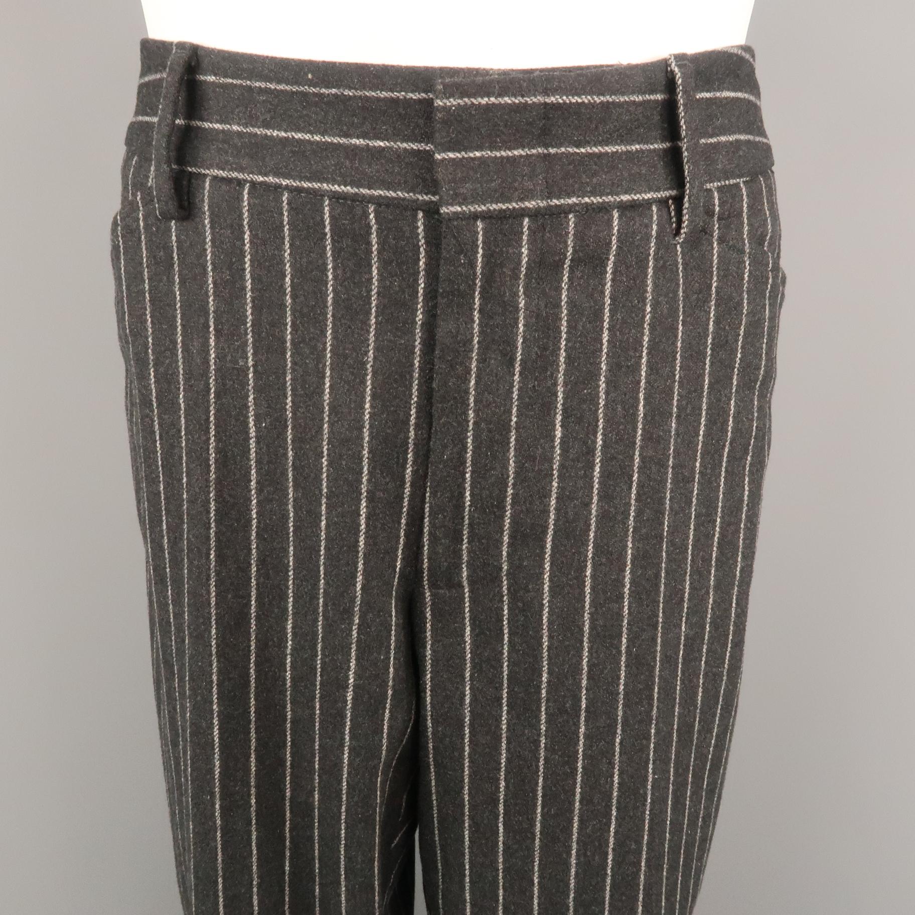 DOLCE & GABBANA dress pant comes in a charcoal chalk-stripe wool blend featuring a flat front and cuffed hem style. Made in Italy.
 
Excellent Pre-Owned Condition.
Marked: IT 52
 
Measurements:
 
Waist: 36 in.
Rise: 8 in.
Inseam: 30 in.