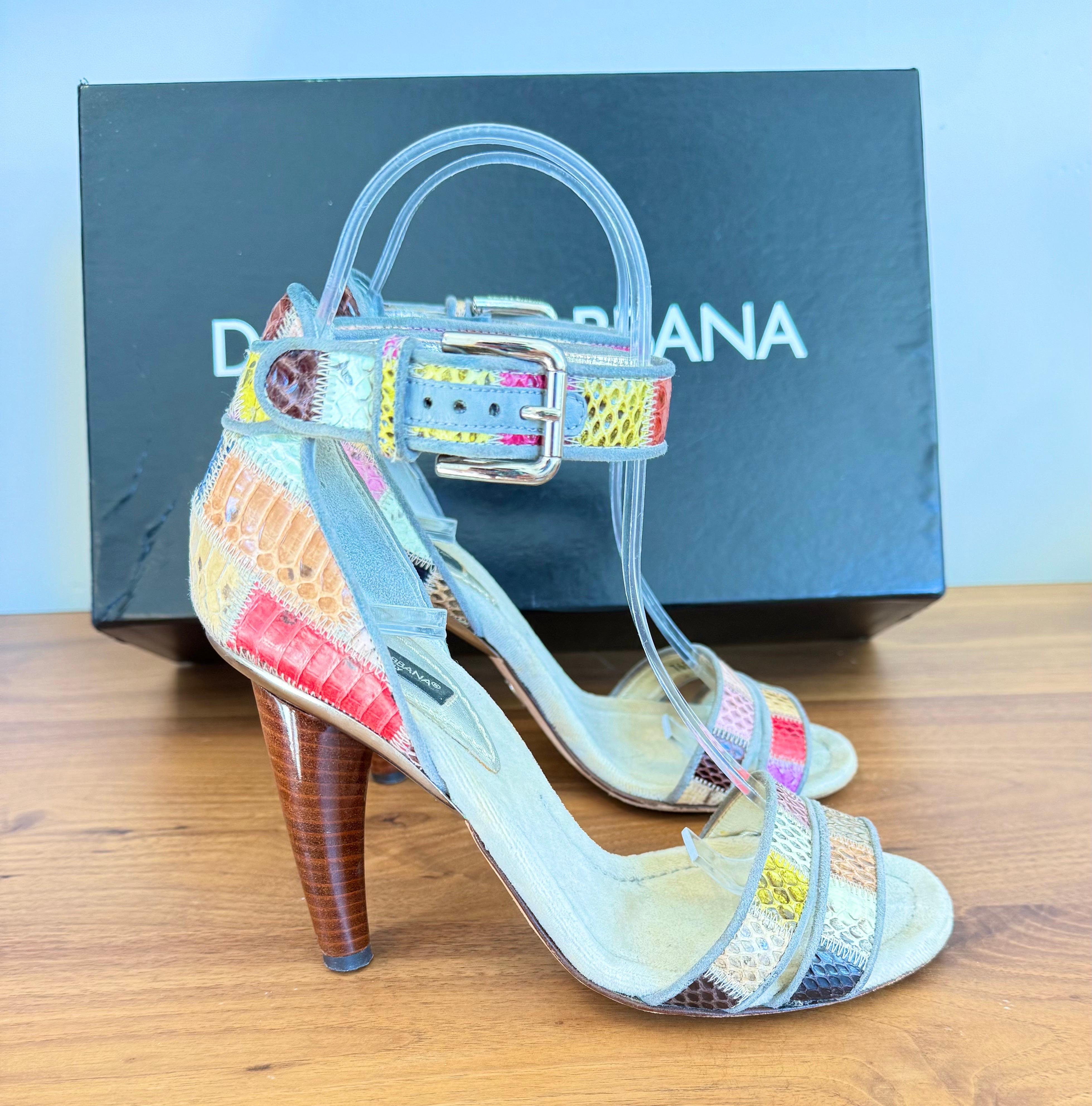 Striking vintage Dolce & Gabbana “Sandalo Patchwork 2 Ayers + Camo” Size 36 / 6 heels from the Spring/Summer 2007 collection, handcrafted in multicolor ayers python and suede with a sculptural stacked cone heel. Comes with box. This design showcases