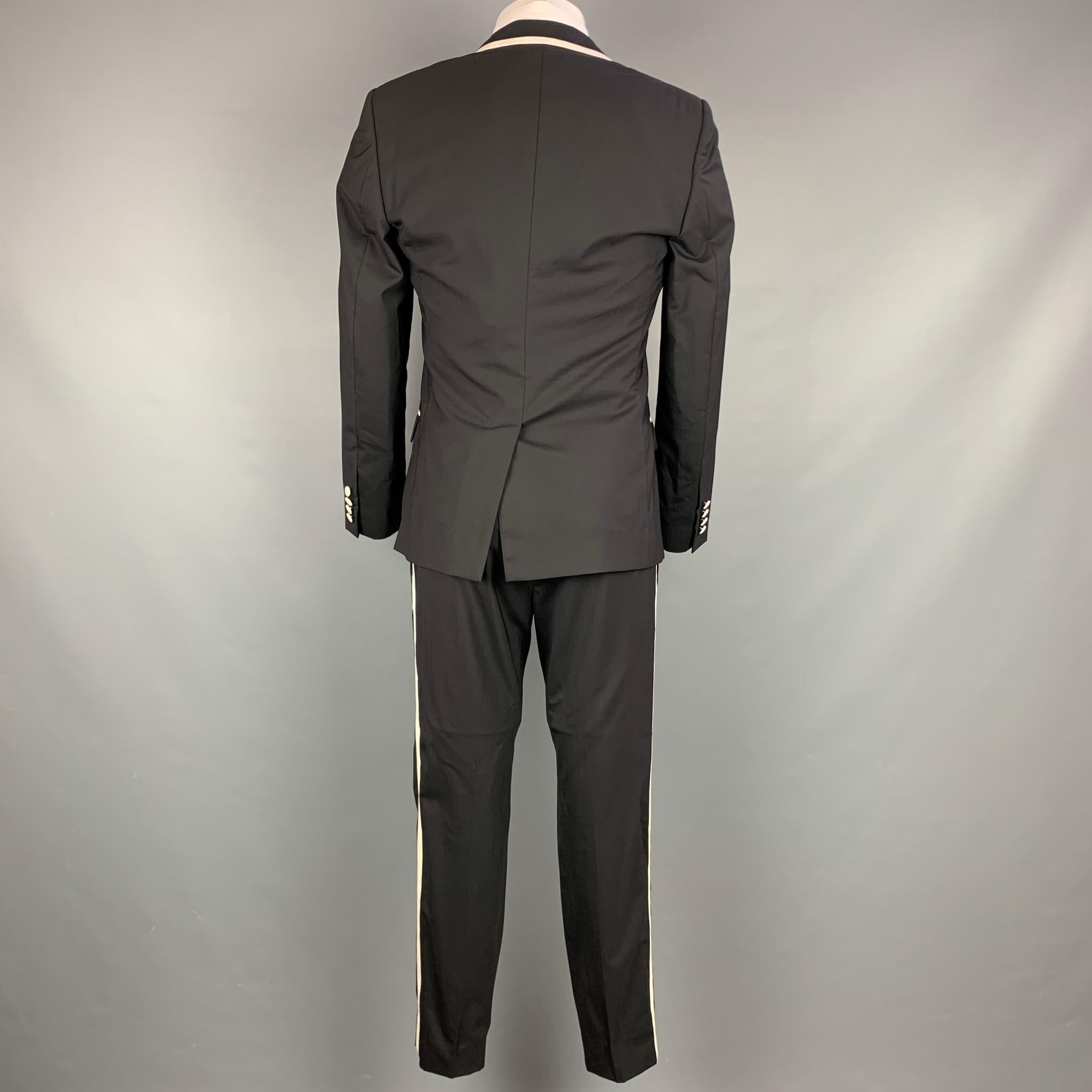 white suit with gold trim