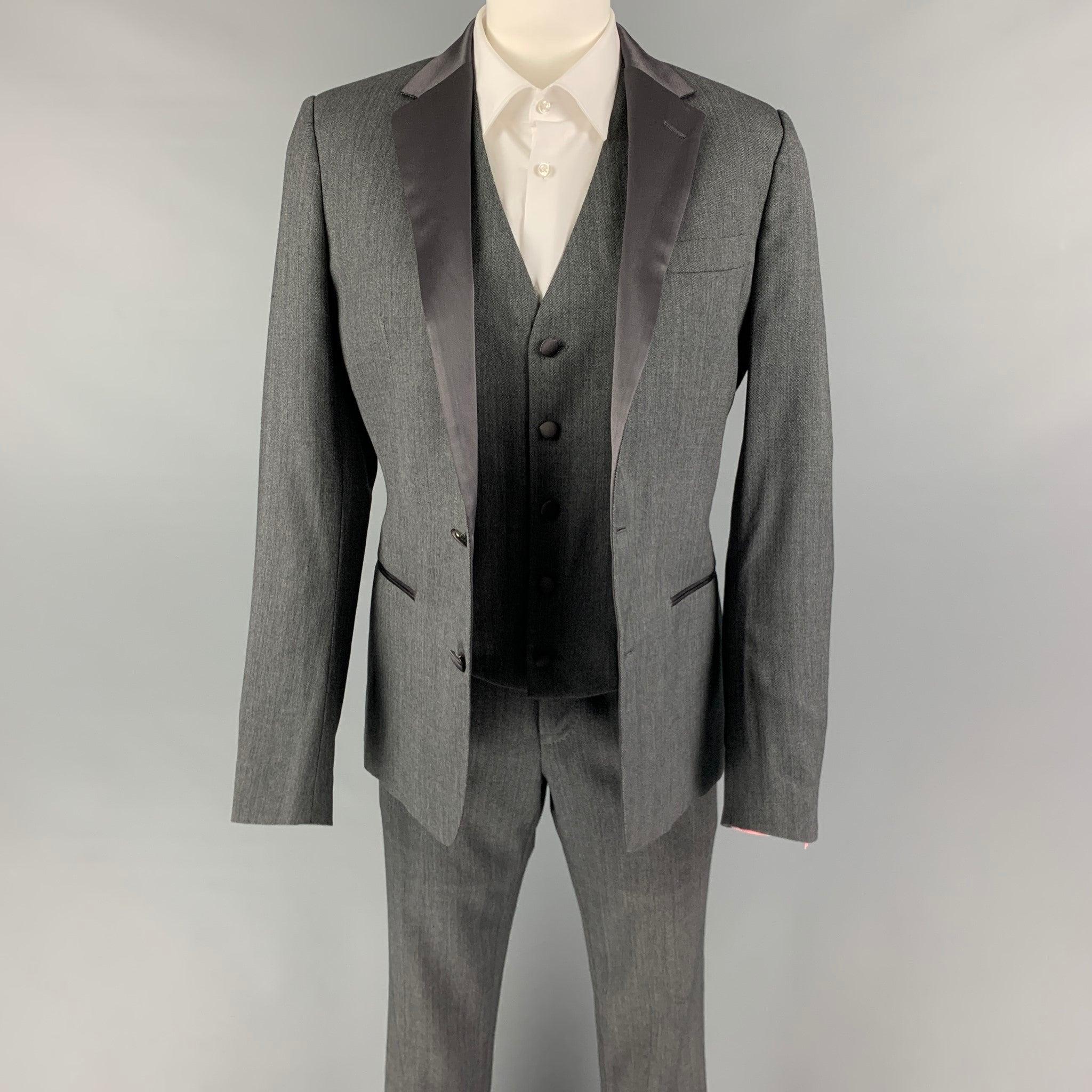 DOLCE & GABBANA
3 Piece suit comes in a grey wool / silk with a full liner and includes a single breasted, double button sport coat with a notch lapel and matching flat front trousers. Excellent Pre-Owned Condition. 

Marked:   46 

Measurements: 
 