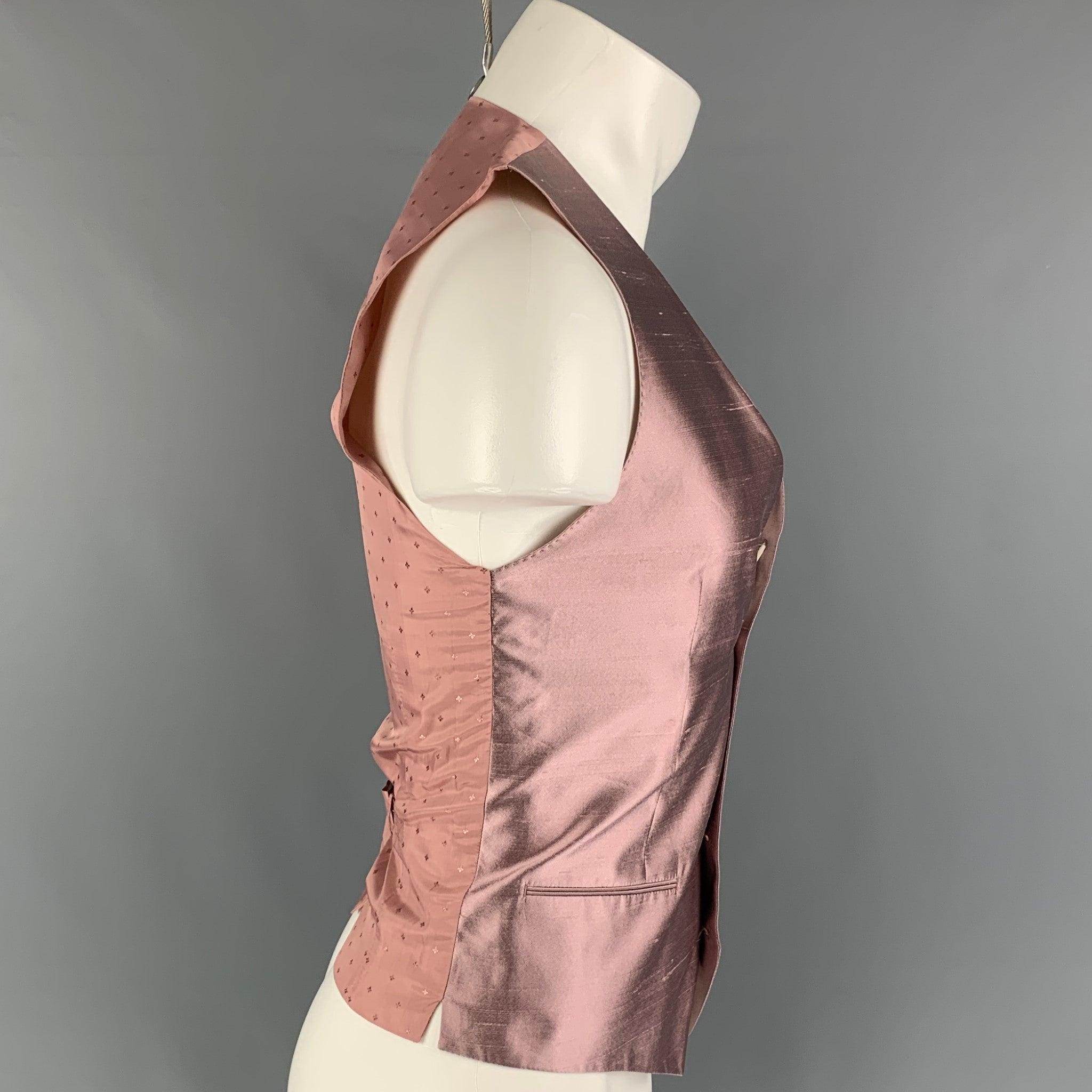 DOLCE & GABBANA vest comes in a mauve silk featuring a back belt strap, slit pockets, and a buttoned closure. Made in Italy.
Very Good
Pre-Owned Condition. 

Marked:   46 

Measurements: 
 
Shoulder: 13.75 inches  Chest: 35 inches  Length: 23 inches