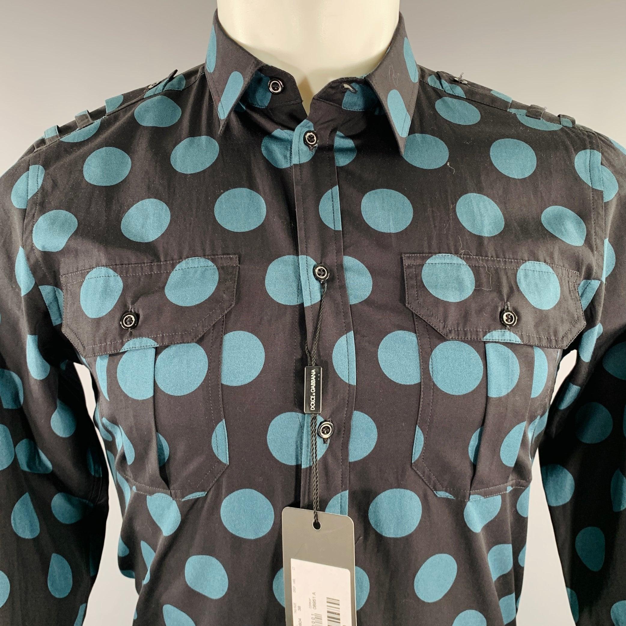 DOLCE & GABBANA GOLD long sleeve shirt
in a black cotton woven fabric featuring a blue dots pattern, epaulettes, two buttoned chest pockets, and button closure. Made in Italy.New with Tags. 

Marked:   15/38 

Measurements: 
 
Shoulder: 16 inches