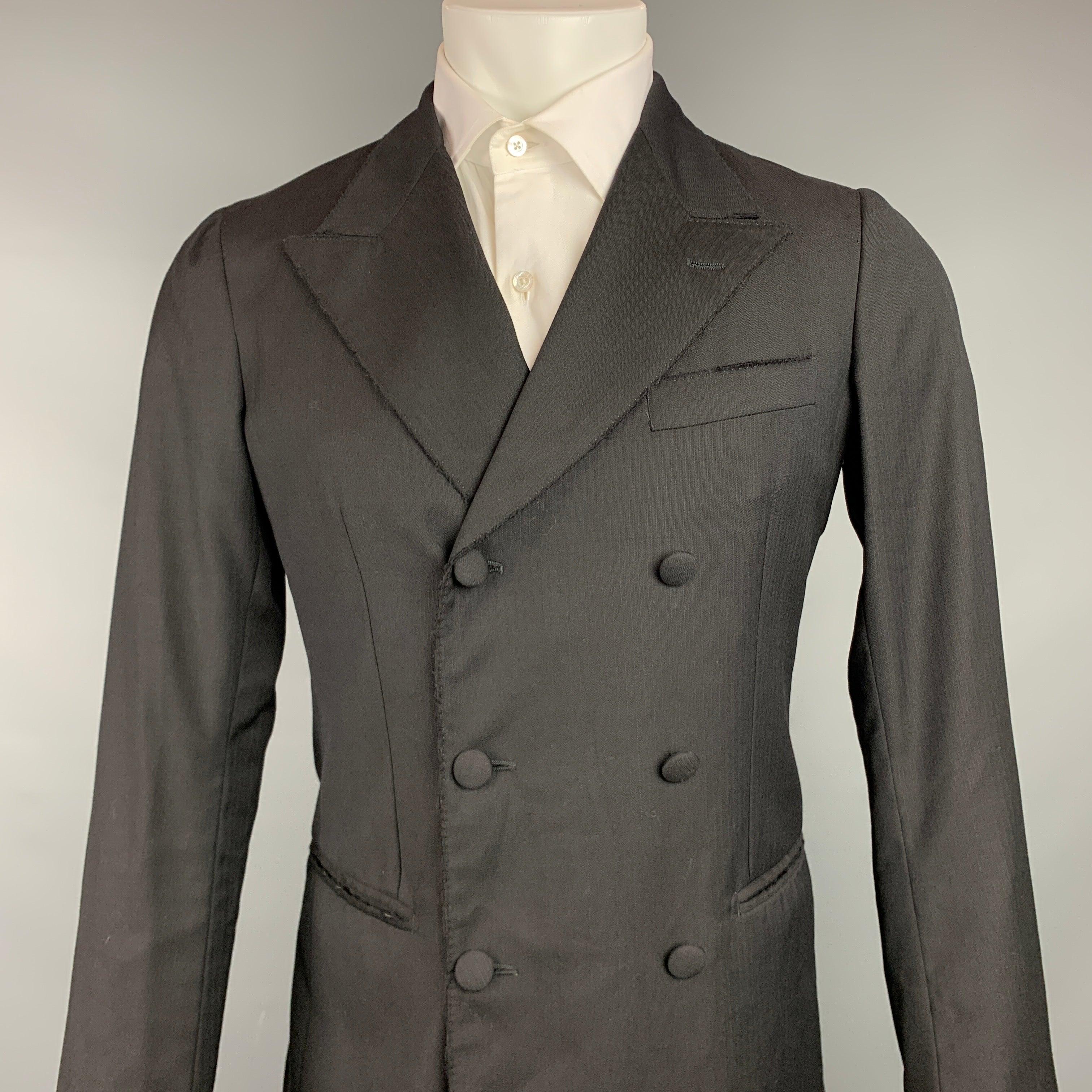 DOLCE & GABBANA
sport coat comes in a black wool with a full liner featuring a peak lapel, slit pockets, and double breasted closure. Made in Italy.Very Good Pre-Owned Condition. 

Marked:   48 

Measurements: 
 
Shoulder: 16.5 inches  Chest: 38