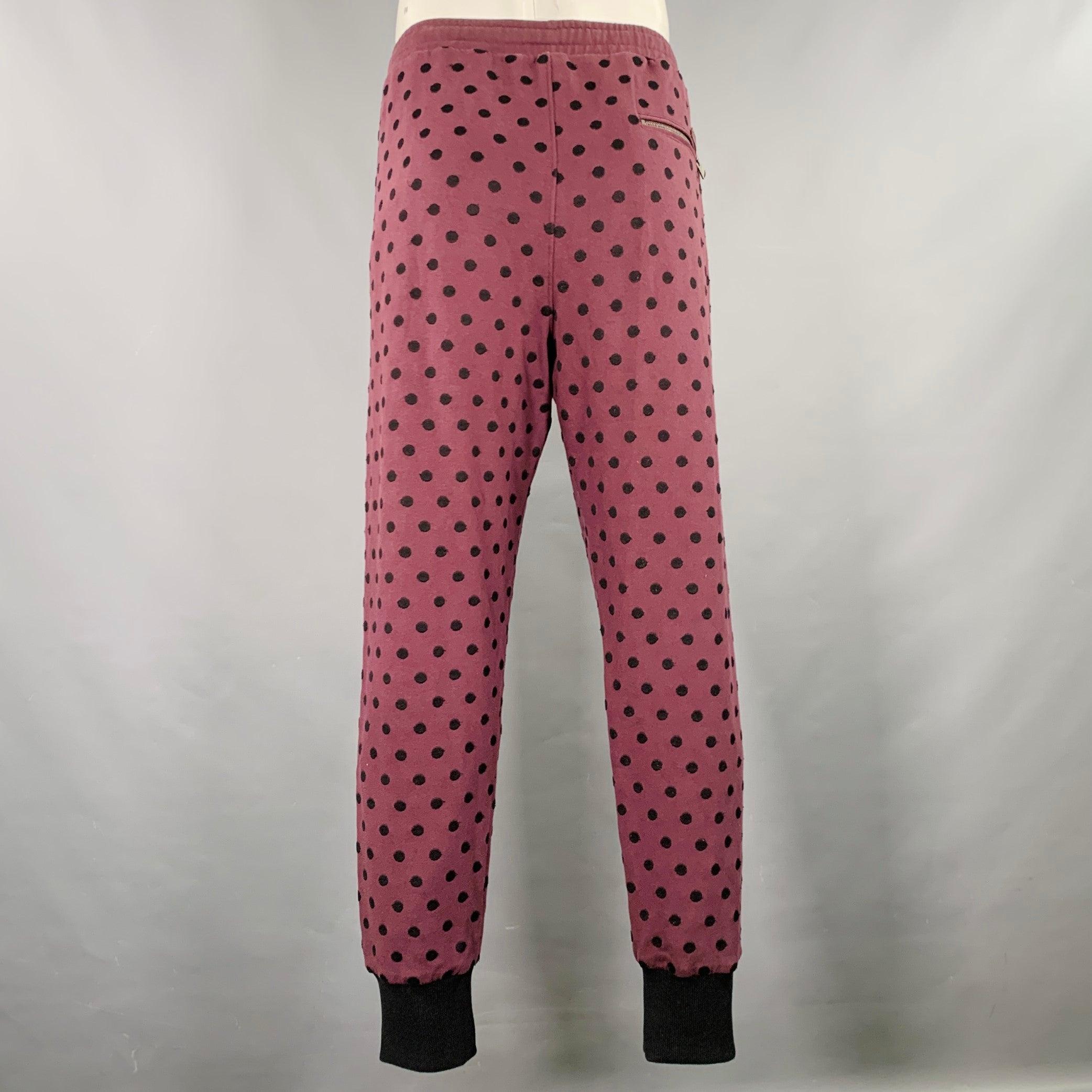 DOLCE & GABBANA casual pants
in a burgundy cotton jersey featuring a sweatpants style, black polka dot pattern, rib knit cuffs, and drawstring waistband. Made in Italy.Excellent Pre-Owned Condition. 

Marked:   IT 54 

Measurements: 
  Waist: 36 -