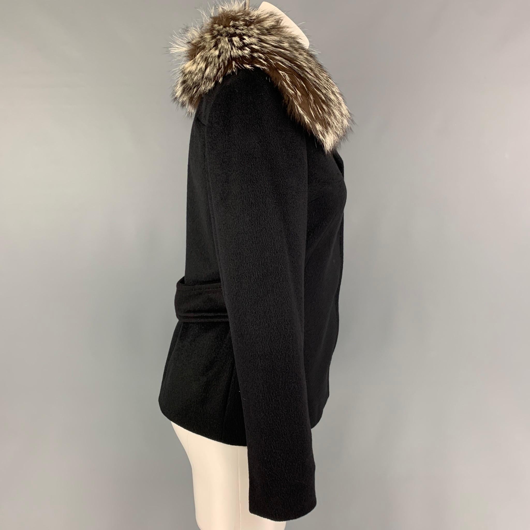 DOLCE & GABBANA jacket comes in a black angora with a full floral liner featuring a fur collar, back strap, and a buttoned closure. Made in Italy. 

Very Good Pre-Owned Condition.
Marked: 40

Measurements:

Shoulder: 15 in.
Bust: 35 in.
Sleeve: 25