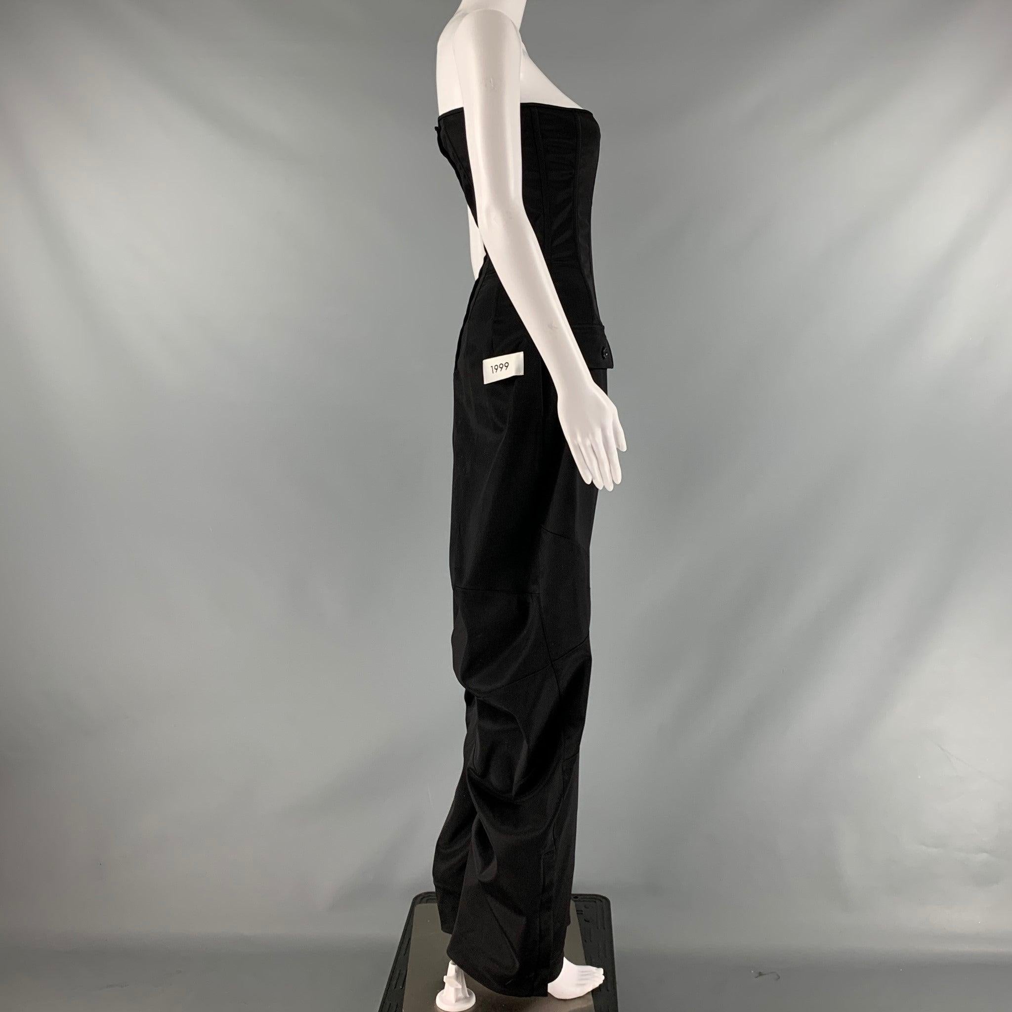 DOLCE & GABBANA KIM jumpsuit comes in black acetate blend knit material featuring a corset design, wide-leg, cargo style, and hook and eye closure. Made in Italy.Excellent Pre-Owned Condition. Minor sing of wear. 

Marked:   40 

Measurements: 
 