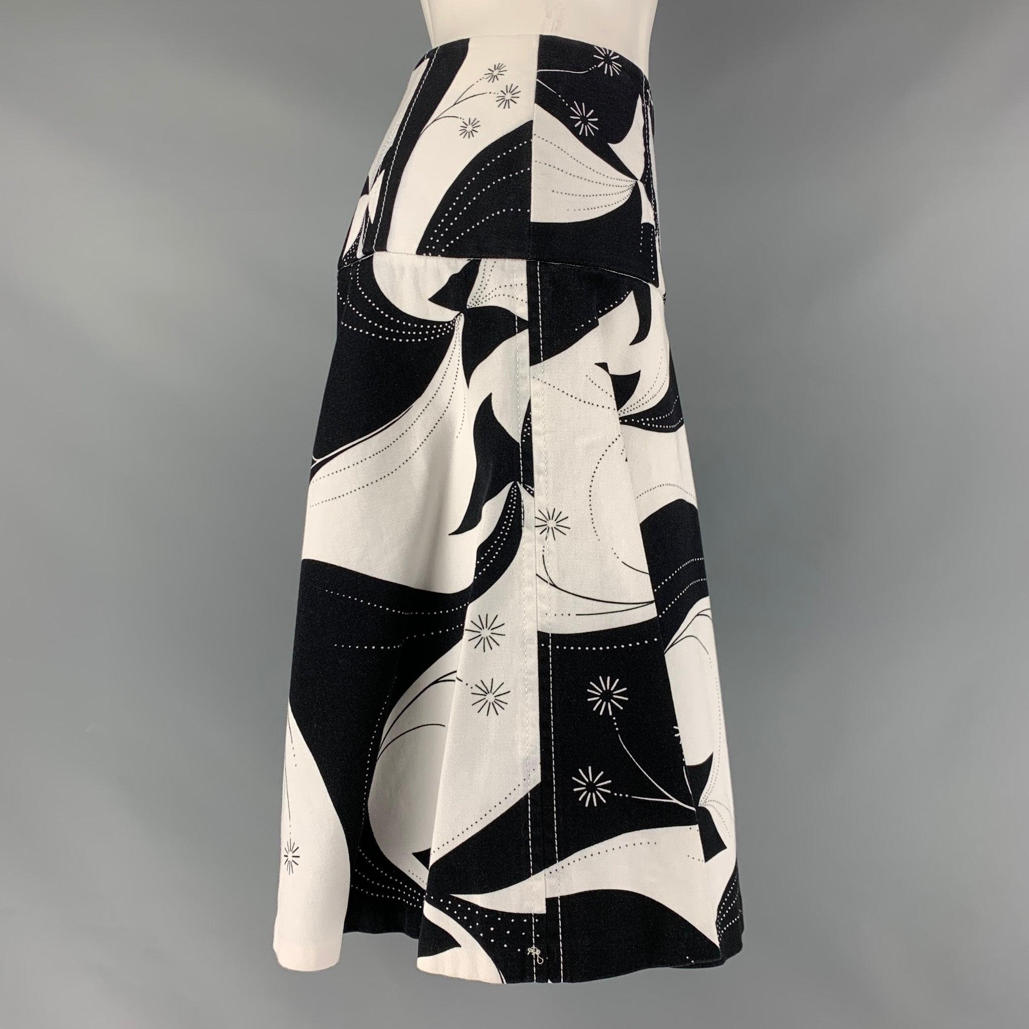 DOLCE & GABBANA circle skirt comes in a black and white abstract cotton twill fabric featuring an a-line style, and a side zip up closure. Made in Italy. Excellent Pre-Owned Condition. 

Marked:   40 

Measurements: 
  Waist: 29 inches Hip: 38