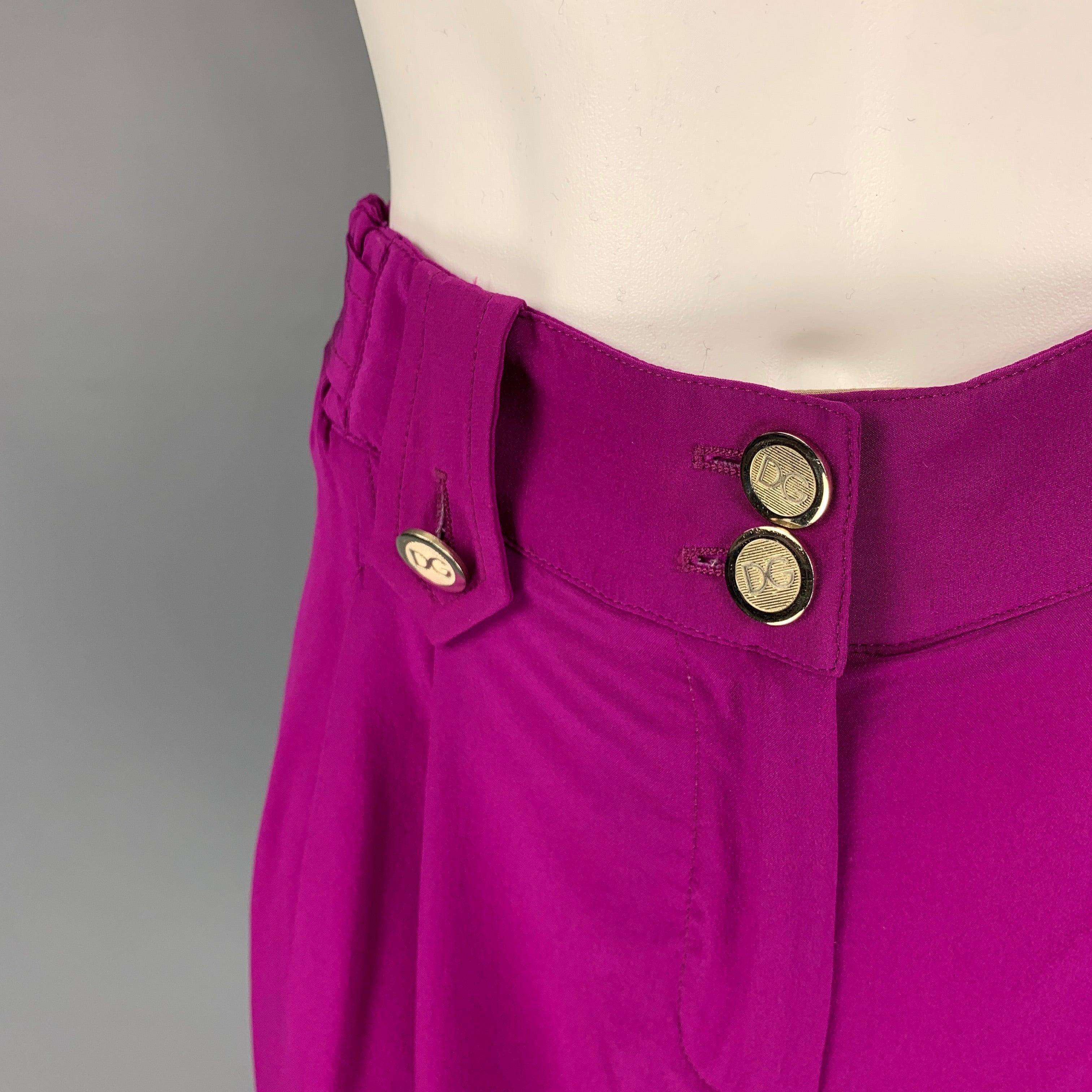 DOLCE & GABBANA shorts comes in a purple silk with a beige trim featuring a pleated style, gold tone logo buttons, and a zip fly closure. Made in Italy.
Very Good
Pre-Owned Condition. 

Marked:   40 

Measurements: 
  Waist: 30 inches  Rise: 9