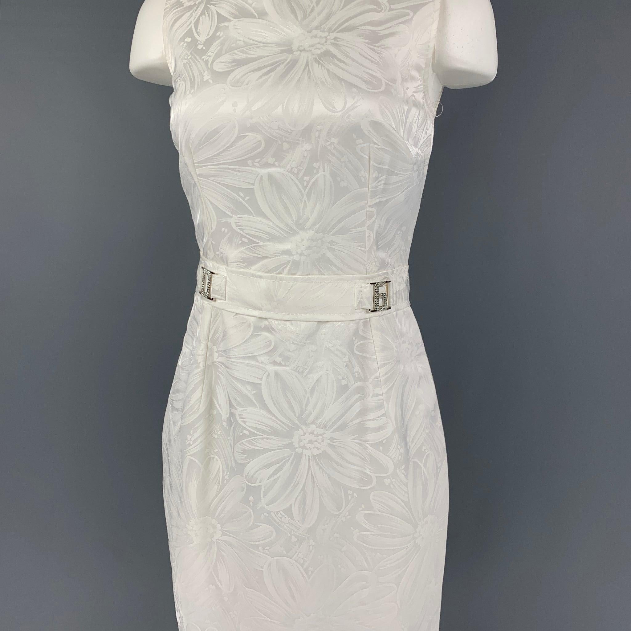 DOLCE & GABBANA dress comes in a white cotton featuring an a-line style, DG rhinestone detail, sleeveless, and a back zip up closure. Made in Italy.
New With Tags. 

Marked:   40 

Measurements: 
 
Shoulder: 13 inches  Bust: 30 inches  Waist: 26