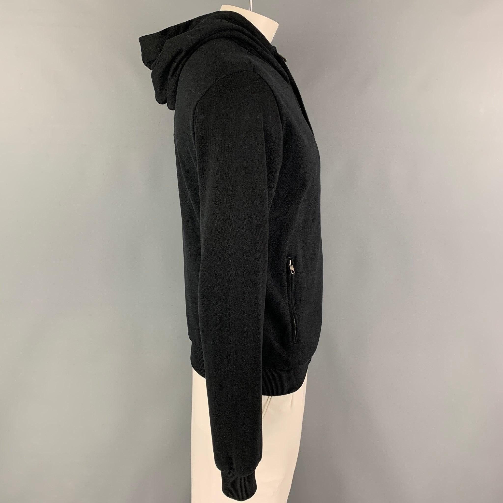 DOLCE & GABBANA jacket comes in a black cotton featuring a embroidered logo, hooded, zipper pockets, and a full zip up closure. Made in Italy.Excellent
Pre-Owned Condition. 

Marked:   50 

Measurements: 
 
Shoulder: 19.5 inches Chest: 42 inches