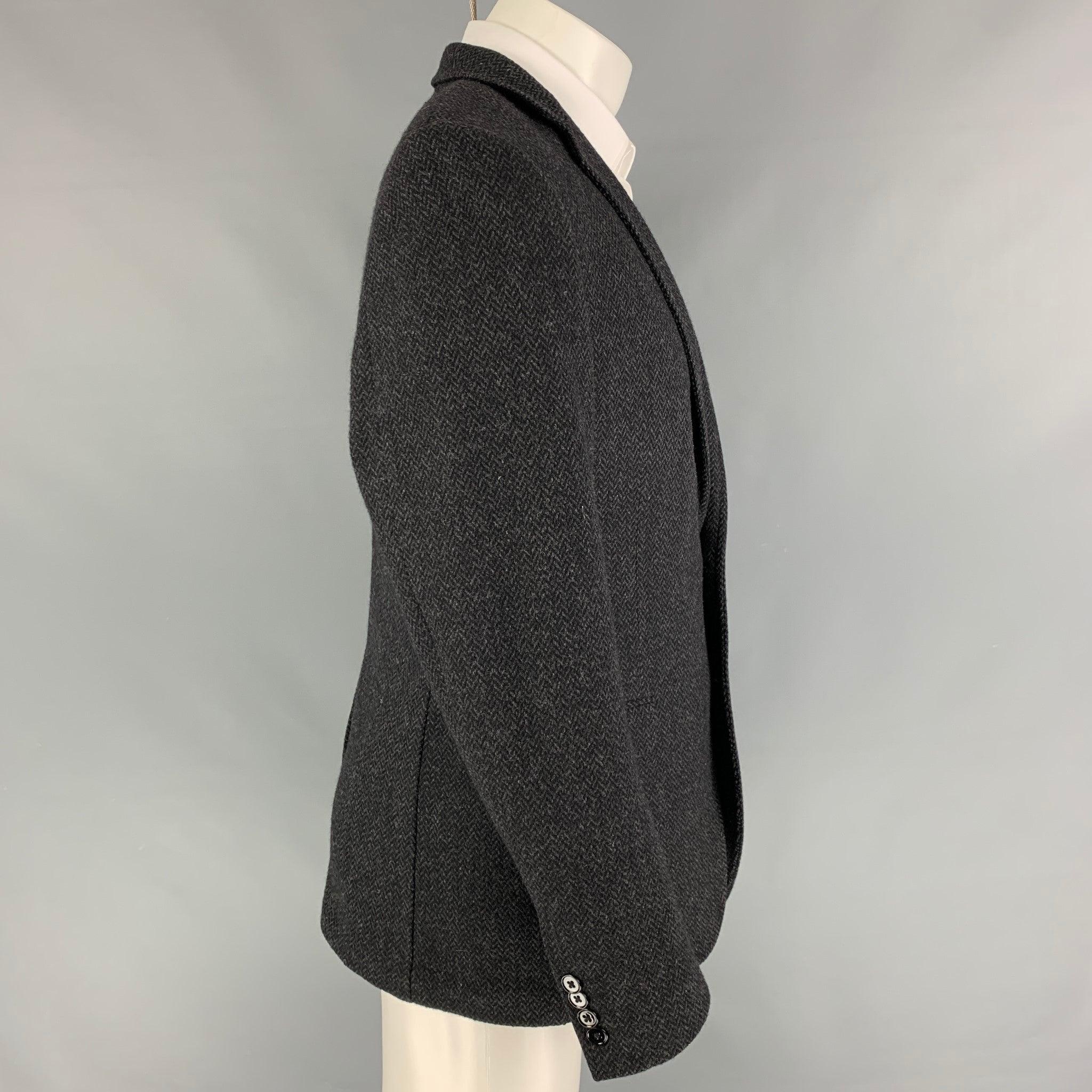 DOLCE & GABBANA sport coat comes in a grey cashmere with a half liner featuring a notch lapel, flap pockets, single back vent, and a double button closure. Made in Italy.
Very Good
Pre-Owned Condition.  

Marked:   50 

Measurements: 
 
Shoulder: 18