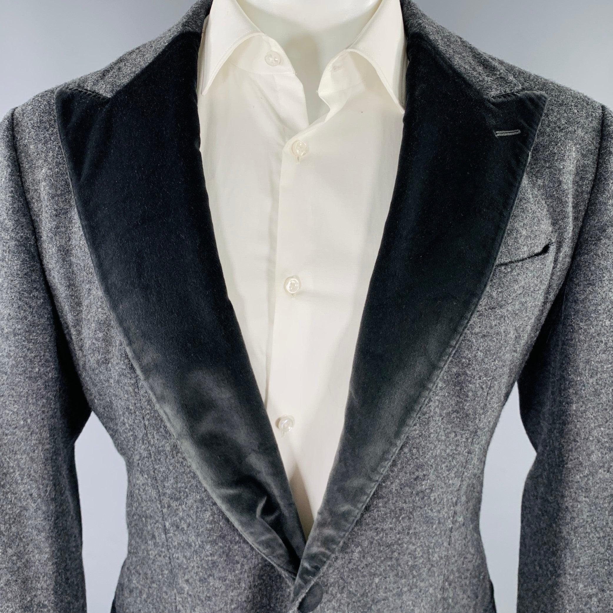 DOLCE & GABBANA sport coat
in a grey virgin wool blend fabric featuring a two toned style with velvet peak lapel, single vented back, and double button closure. Made in Italy.Excellent Pre-Owned Condition. 

Marked:   IT 50 

Measurements: 
