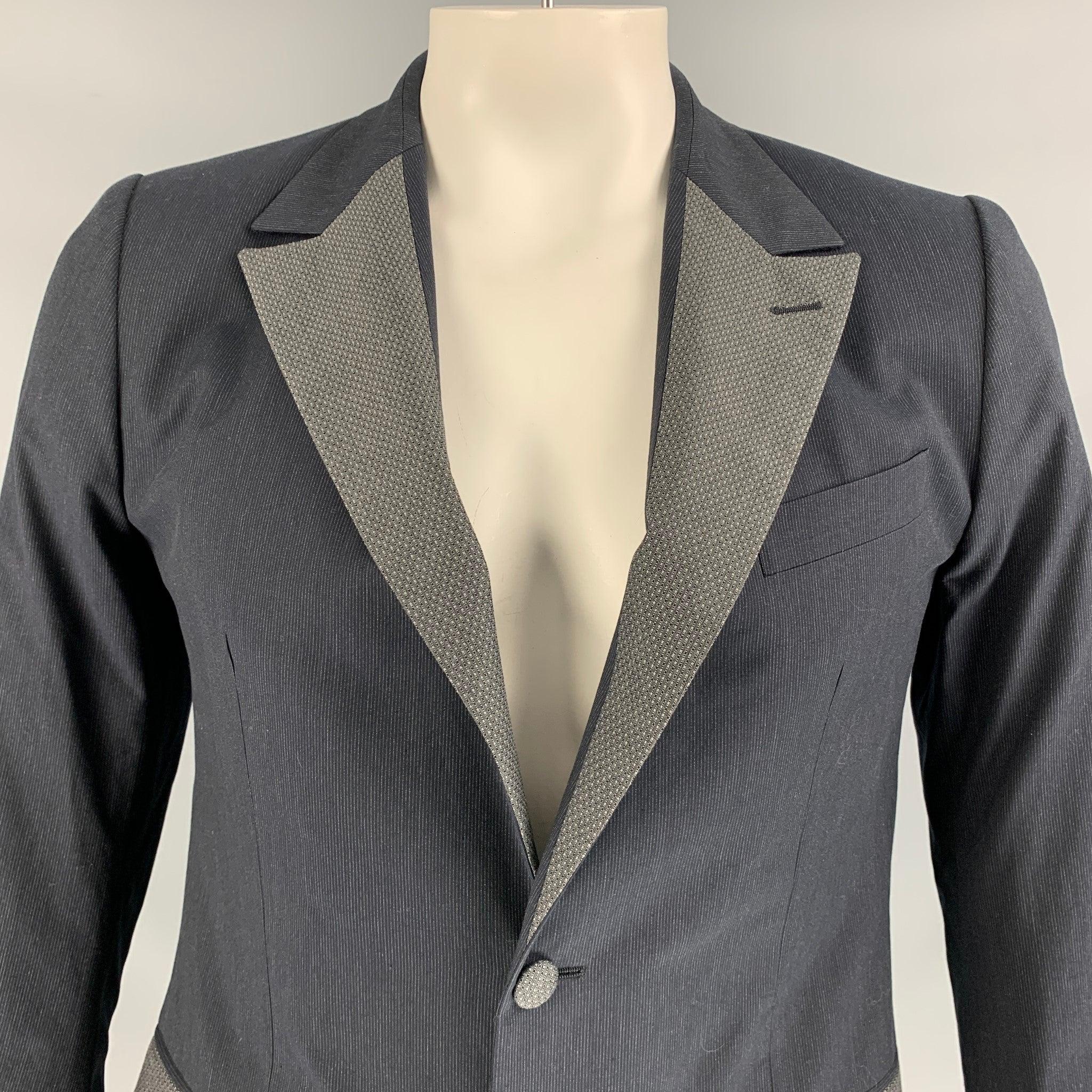 DOLCE & GABBANA long sleeve sport coat comes in charcoal cotton features a two button closure, straight flap pockets and a grey pinstripe notch lapel. Made in Italy. Excellent Pre-Owned Condition. 

Marked:   50 IT 

Measurements: 
 
Shoulder: 17