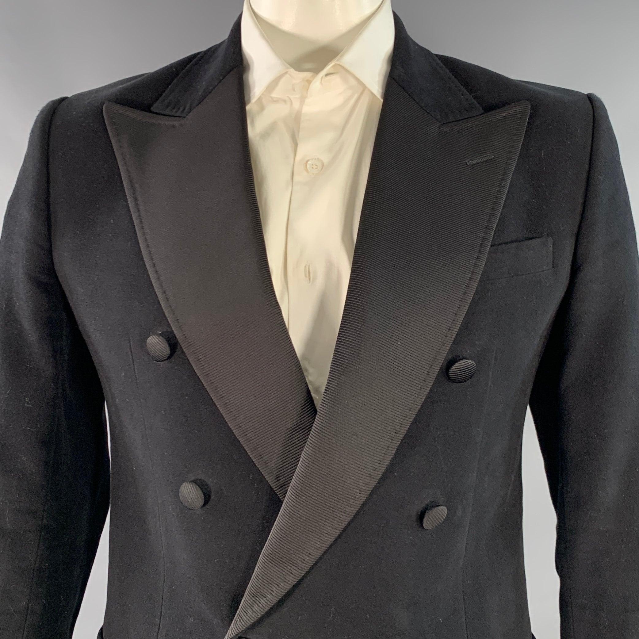 DOLCE & GABBANA sport coat
in a black cotton blend moleskin featuring a double breasted style, grosgrain peak lapel, single vented back, and single button closure.
Made in Italy.Excellent Pre-Owned Condition. 

Marked:   IT 52 

Measurements: 
