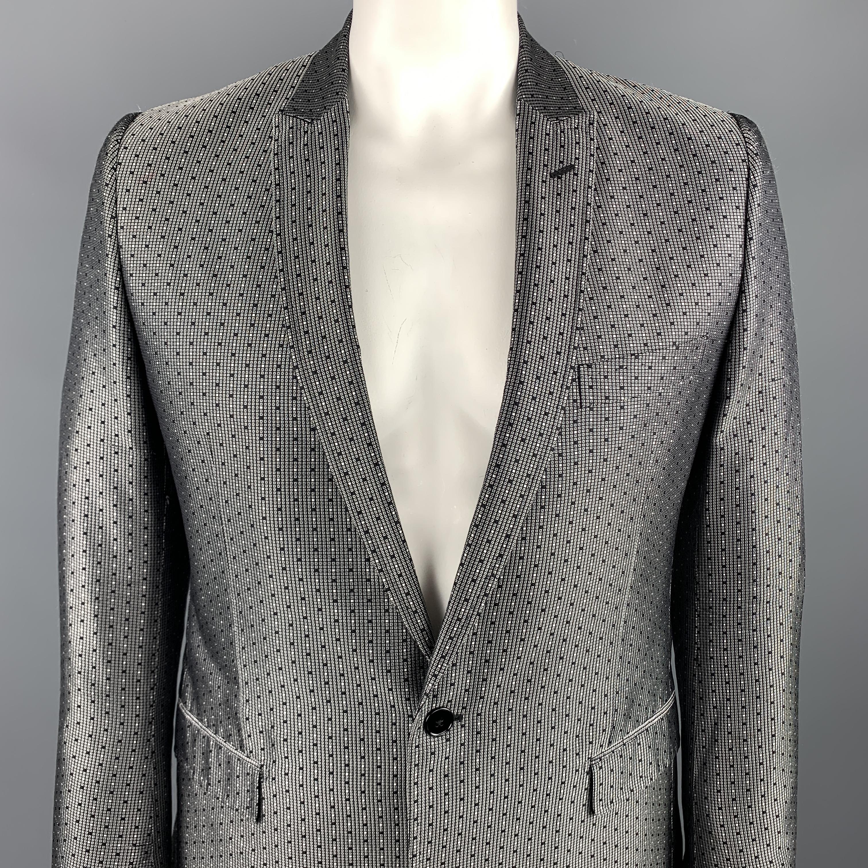 DOLCE & GABBANA sport coat comes in a black and silver jacquard silk featuring a peak lapel style, flap pockets, and a single button closure. Made in Italy.

Excellent Pre-Owned Condition.
Marked: IT 52

Measurements:

Shoulder: 17.5 in. 
Chest: 42