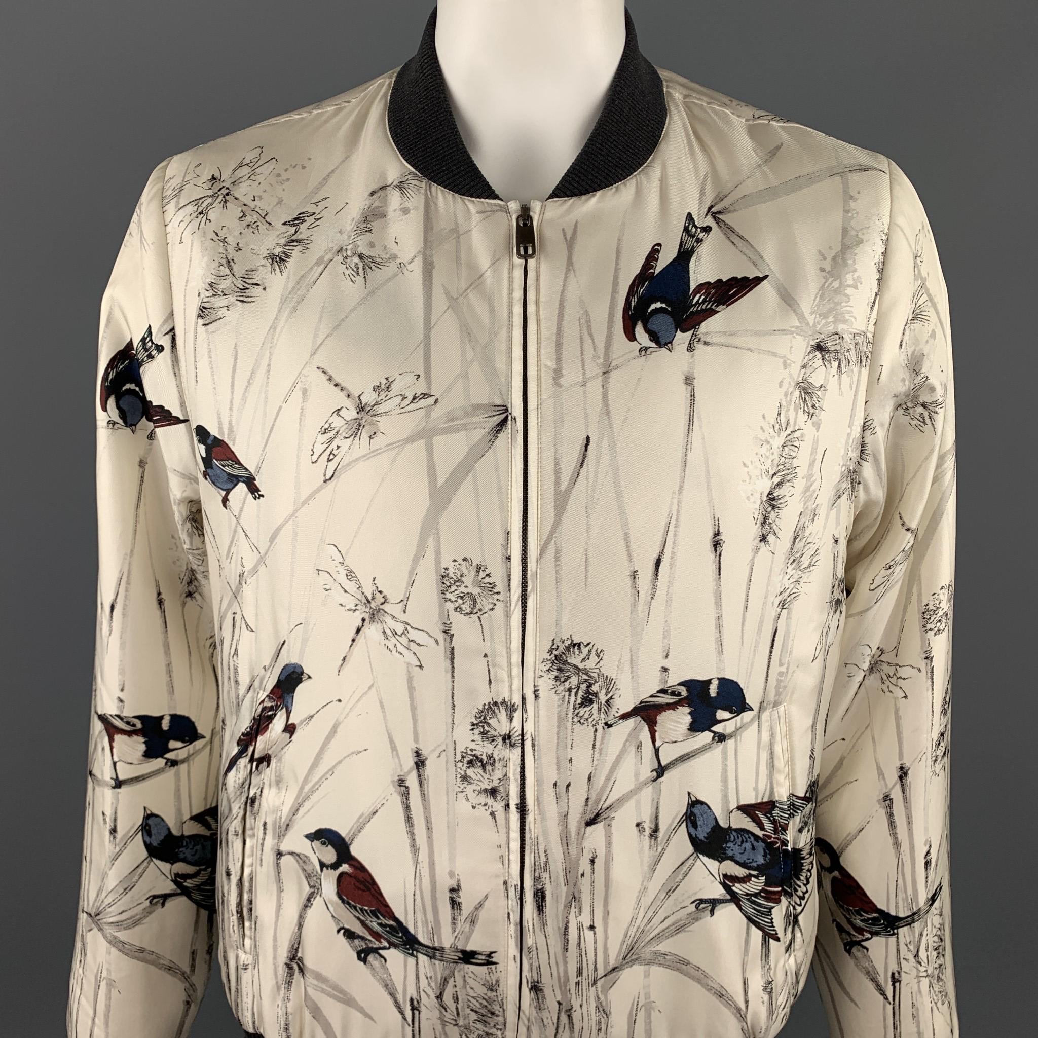 DOLCE & GABBANA jacket comes in a beige silk with a all over bird print featuring a bomber style and a zip up closure. Made in Italy.

Very Good Pre-Owned Condition.
Marked: IT 54
Original Retail Price: $3,150.00

Measurements:

Shoulder: 18 in.