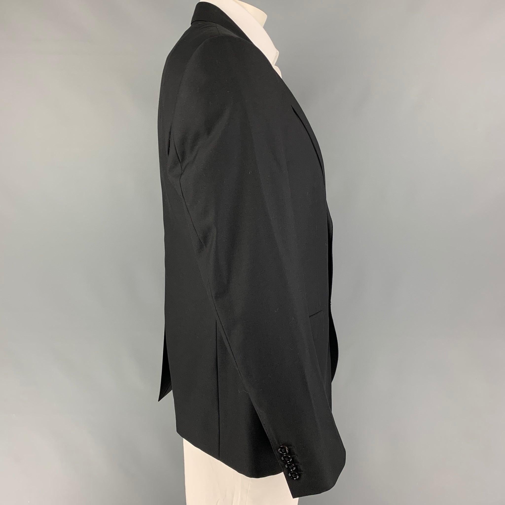DOLCE & GABBANA sport coat comes in a black wool blend with a full liner featuring a peak lapel, flap pockets, single back vent, and a double button closure. Made in Italy.New with tags.
 

Marked:   54 

Measurements: 
 
Shoulder: 18.5 inches 