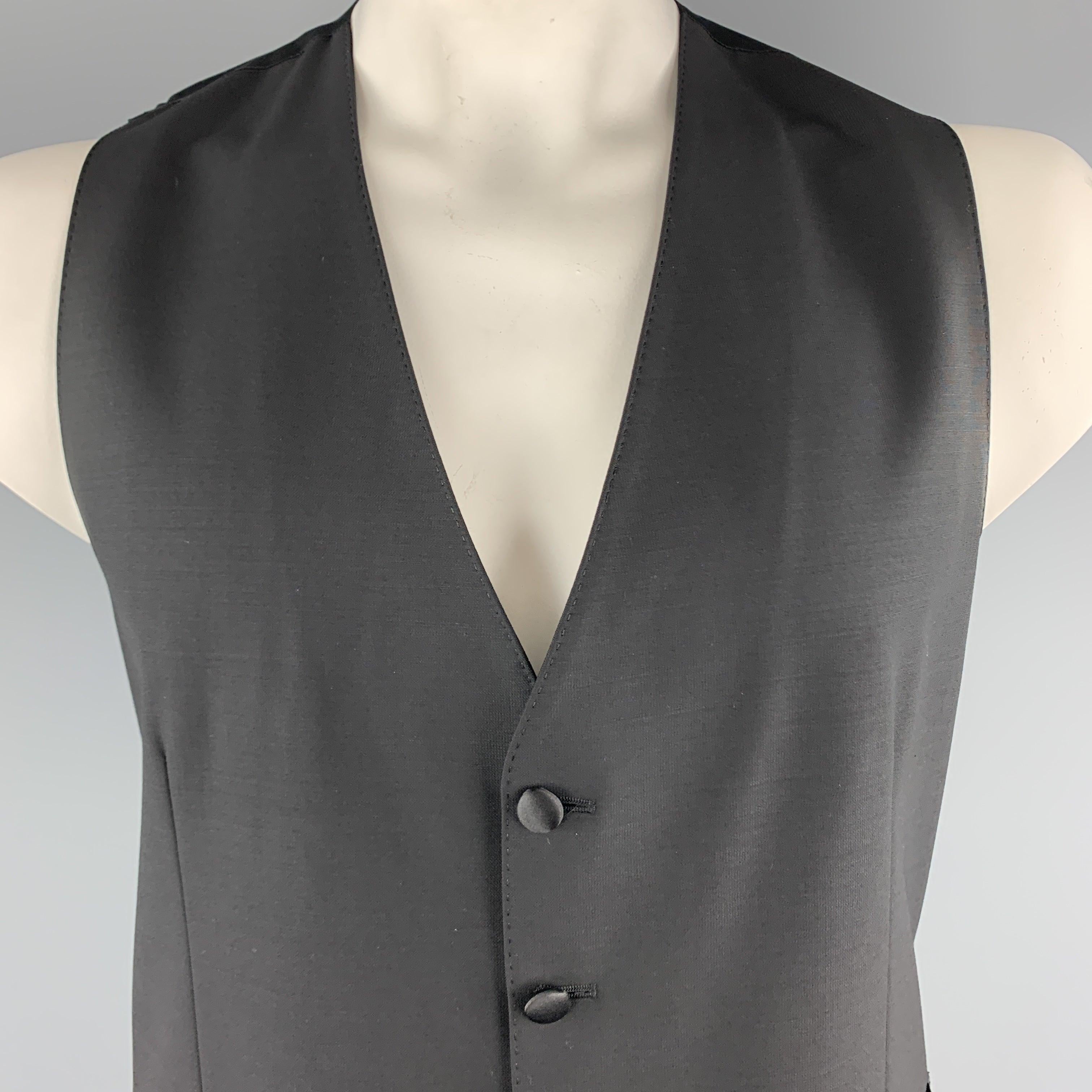 DOLCE & GABBANA dress vest comes in black wool blend with a polka dot satin back. Made in Italy.Excellent
Pre-Owned Condition. 

Marked:   IT 54 

Measurements: 
 
Shoulder: 13.5 inches Chest:
40 inches Length: 28 inches 
  
  
 
Reference:
