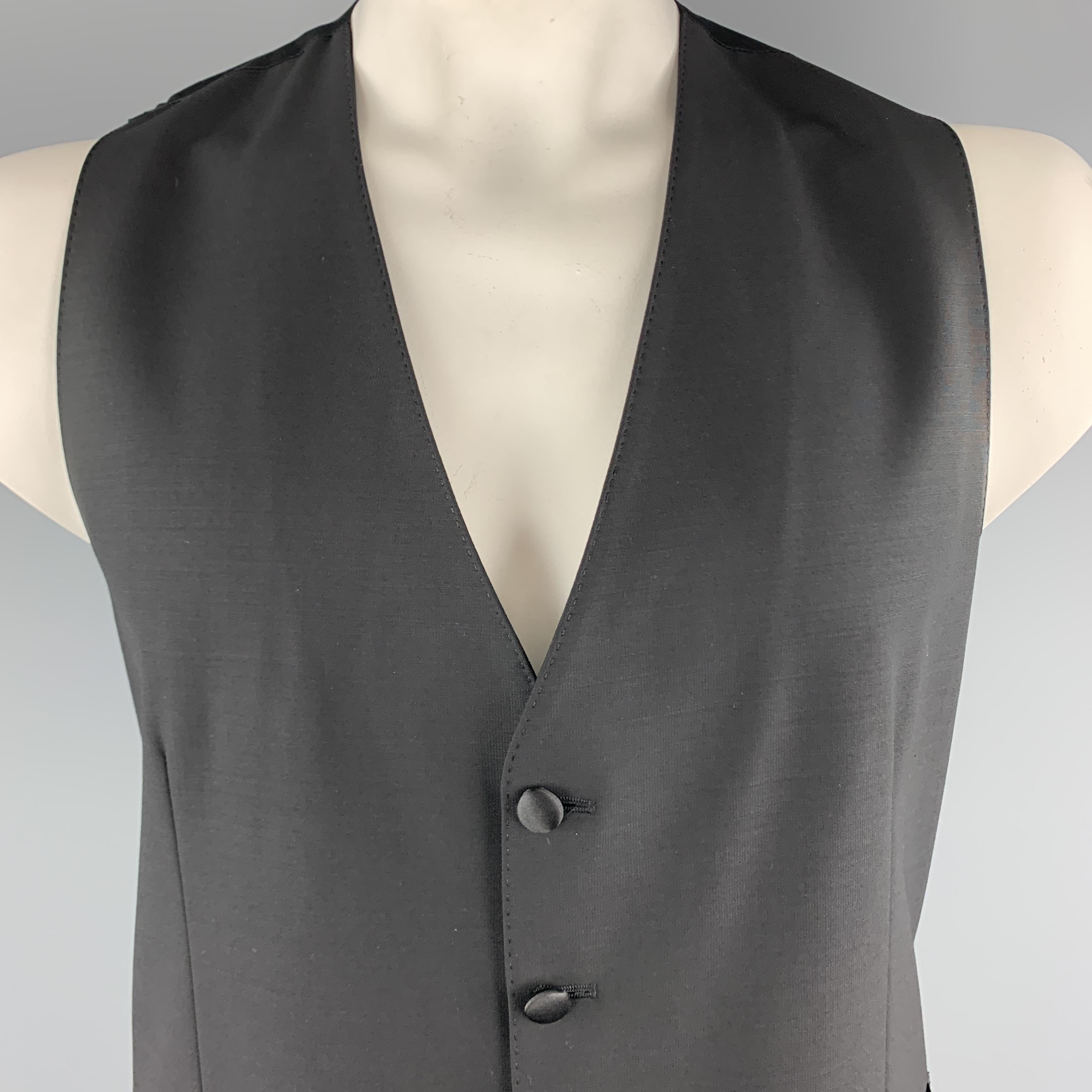 DOLCE & GABBANA dress vest comes in black wool blend with a polka dot satin back. Made in Italy.

Excellent Pre-Owned Condition.
Marked: IT 54

Measurements:

Shoulder: 13.5 in.
Chest: 40 in.
Length: 28 in.