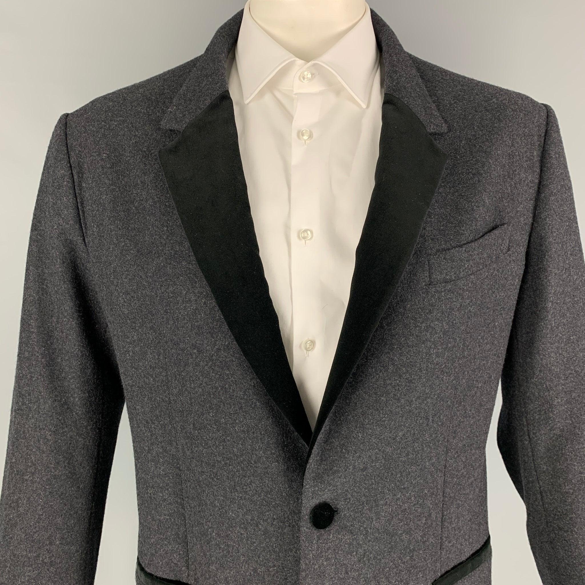 DOLCE & GABBANA sport coat comes in a charcoal & black wool with a velvet trim featuring a notch lapel, slit pockets, double back vent, and a double button closure. Made in Italy.
Excellent
Pre-Owned Condition. 

Marked:   54 

Measurements: 
