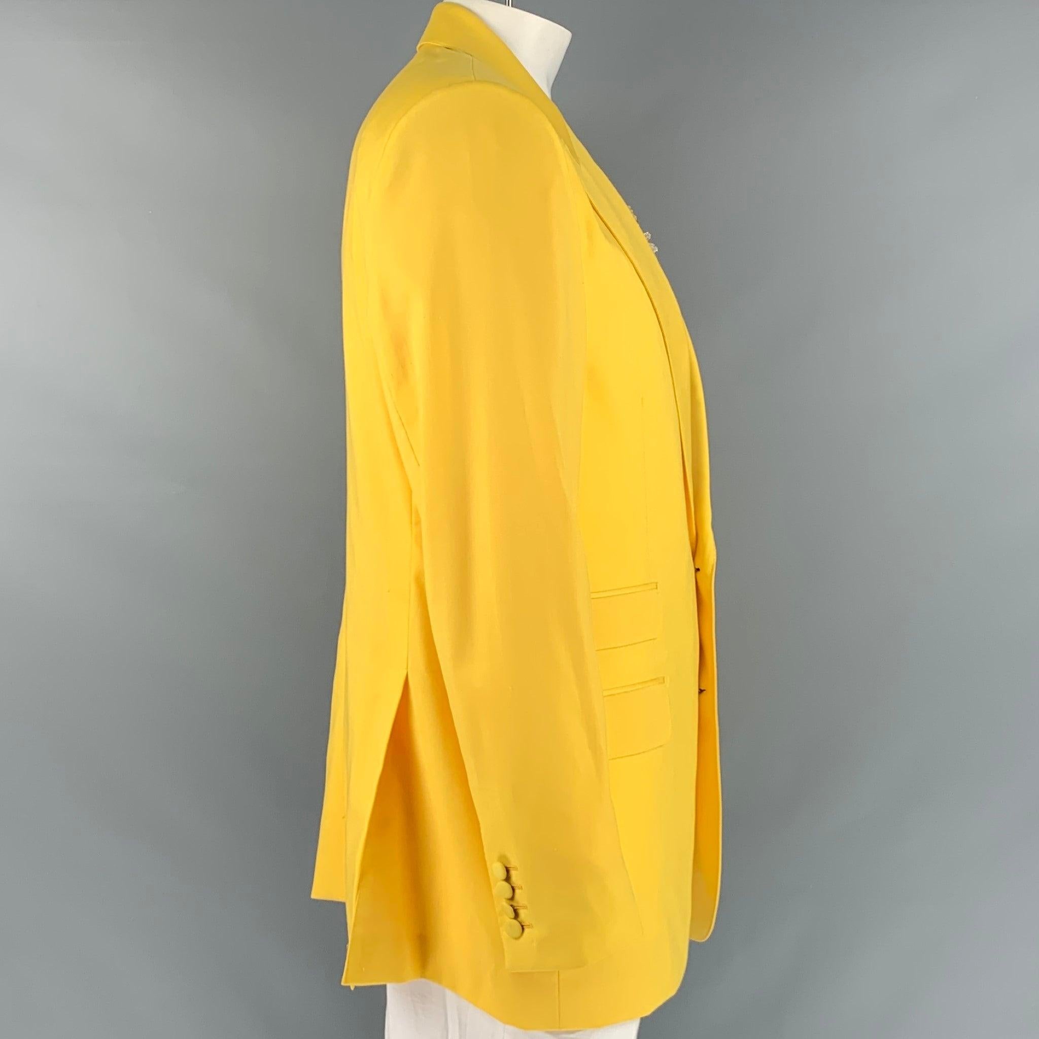 DOLCE & GABBANA sport coat in a yellow wool fabric featuring attached beaded lemon applique brooch, peak lapel, and a two button closure. Made in Italy.Very Good Pre-Owned Condition.  

Marked:   no size marked. 

Measurements: 
 
Shoulder: 18.5