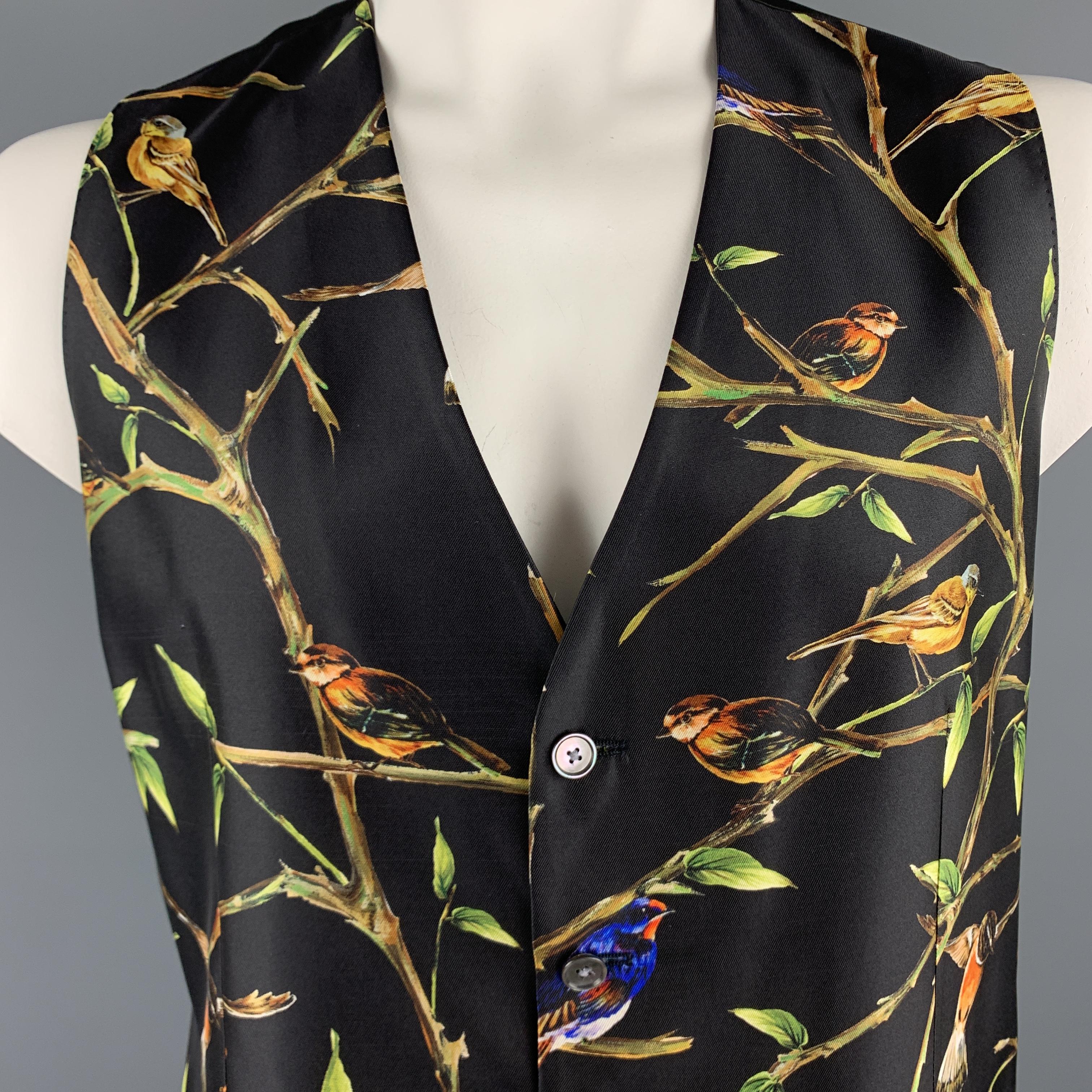 DOLCE & GABBANA vest comes in black silk twill with an all over bird print, V neck, and adjustable back. Made in Italy.

New with Tags. 
Marked: IT 56

Measurements:

Shoulder: 15 in.
Chest: 45 in.
Length: 27.5 in.