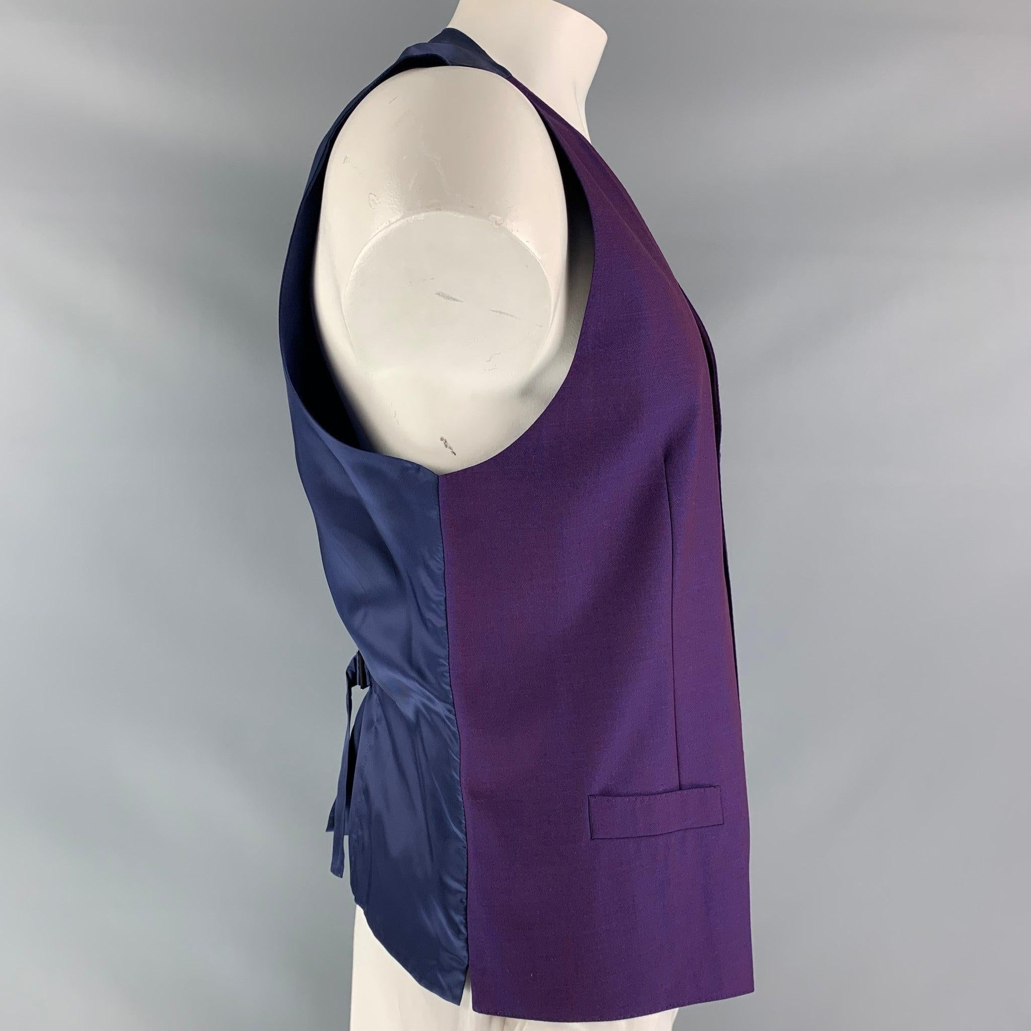 DOLCE & GABBANA dress vest comes in iridescent mohair and wool fabric, full lined featuring V-neck, welt pockets, five buttons down closure, blue viscose fabric at back and adjustable sliding belt. Made in Italy.Excellent Pre-Owned Condition. 