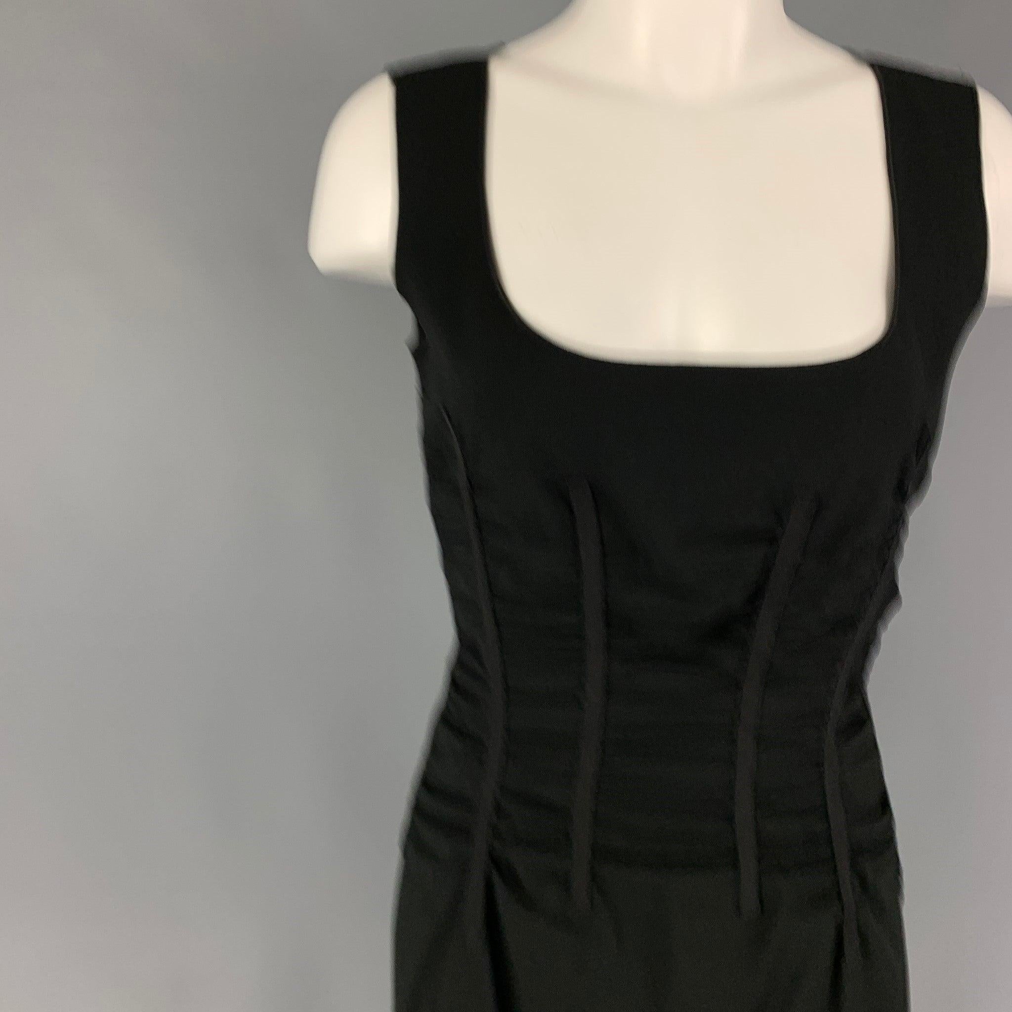 DOLCE & GABBANA cocktail dress comes in a black acetate blend with a animal print interior featuring 
ruched design, sleeveless, and a back zip up closure.
Very Good
Pre-Owned Condition. 

Marked:  42 

Measurements: 
 
Shoulder:
15 inches Bust: 30
