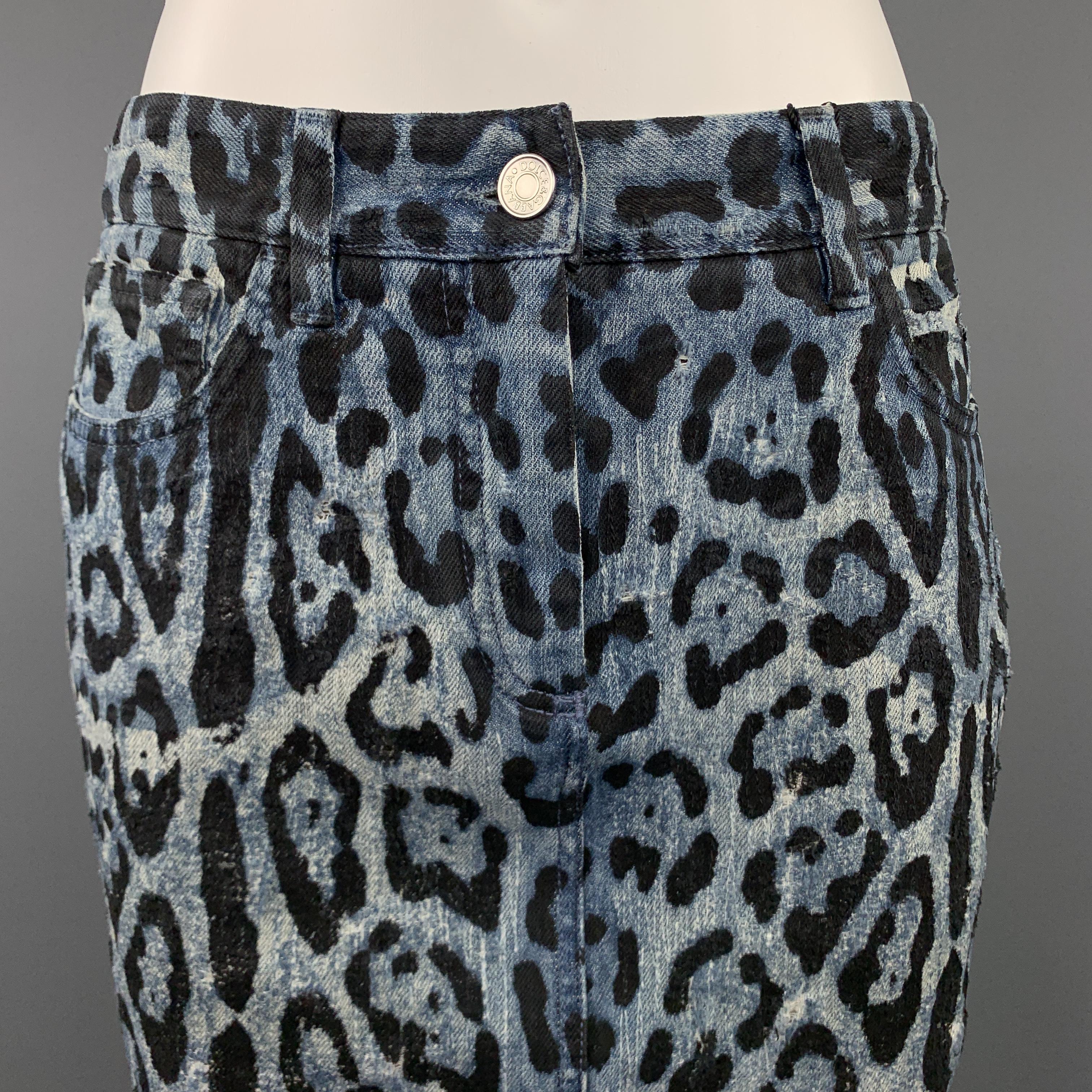 DOLCE & GABBANA pencil skirt comes in washed blue and black leopard print denim with distressing throughout, metal embossed back plaque, and pencil skirt silhouette. Made in Italy.

New with Tags. 
Marked: IT 42
Original Retail Price: