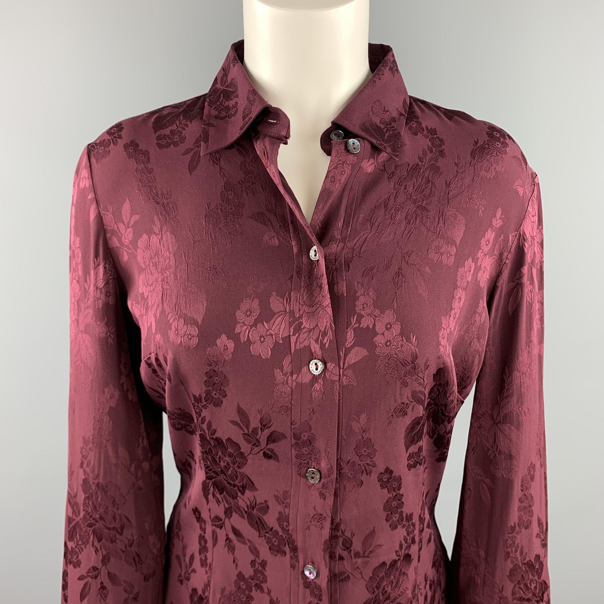 DOLCE & GABBANA blouse comes in a burgundy jacquard floral fabric featuring long sleeves, spread collar, and a buttoned closure. Made in Italy.

Very Good Pre-Owned Condition.
Marked: No size marked

Measurements:

Shoulder: 16 in. 
Bust: 37 in.