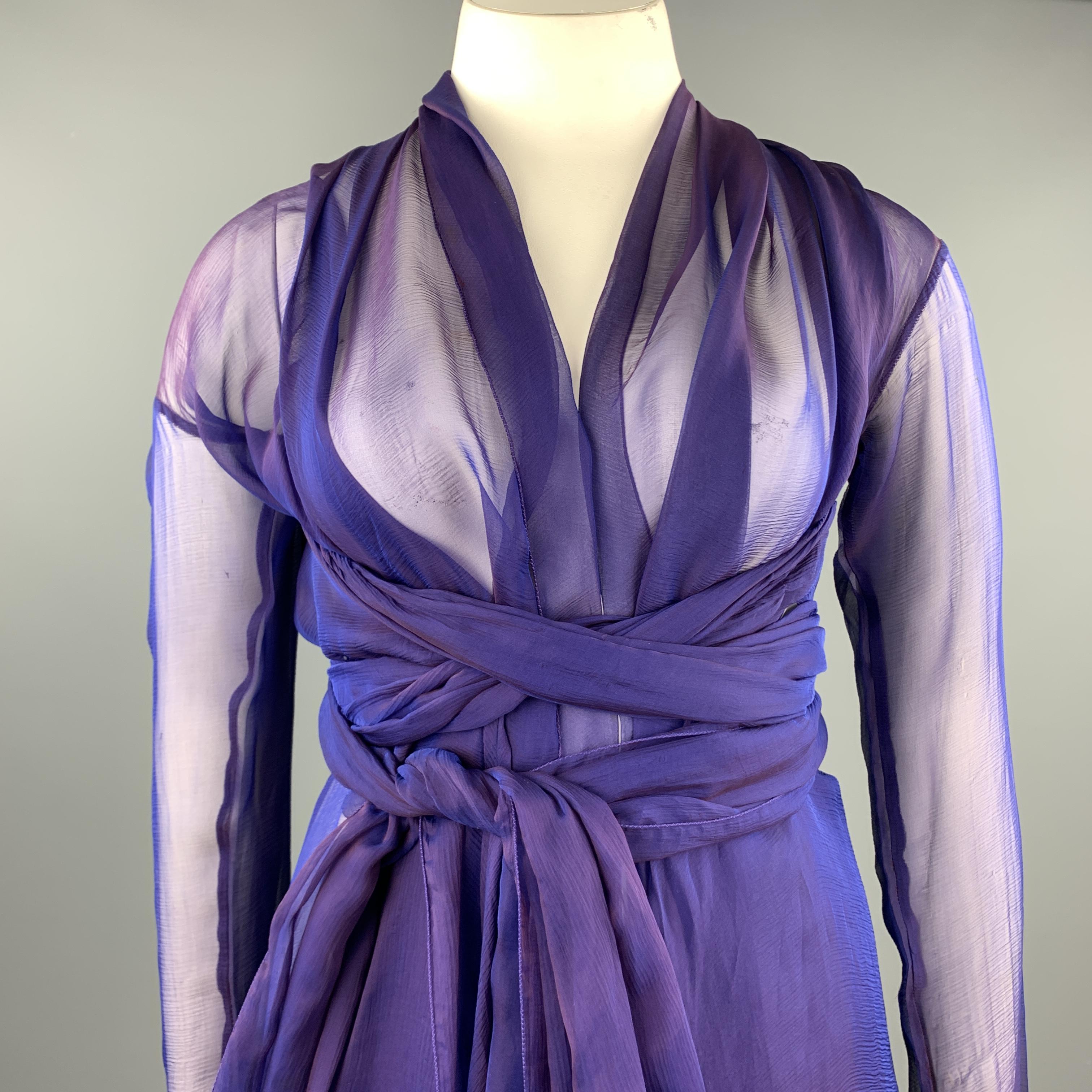 Vintage DOLCE & GABBANA wrap comes in sheer purple silk textured chiffon with a shawl collar, long sleeves, and wrap straps. Wear throughout. As-is. Made in Italy.

Good Pre-Owned Condition.
Marked: IT 42

Measurements:

Shoulder: 22 in.
Bust: 50