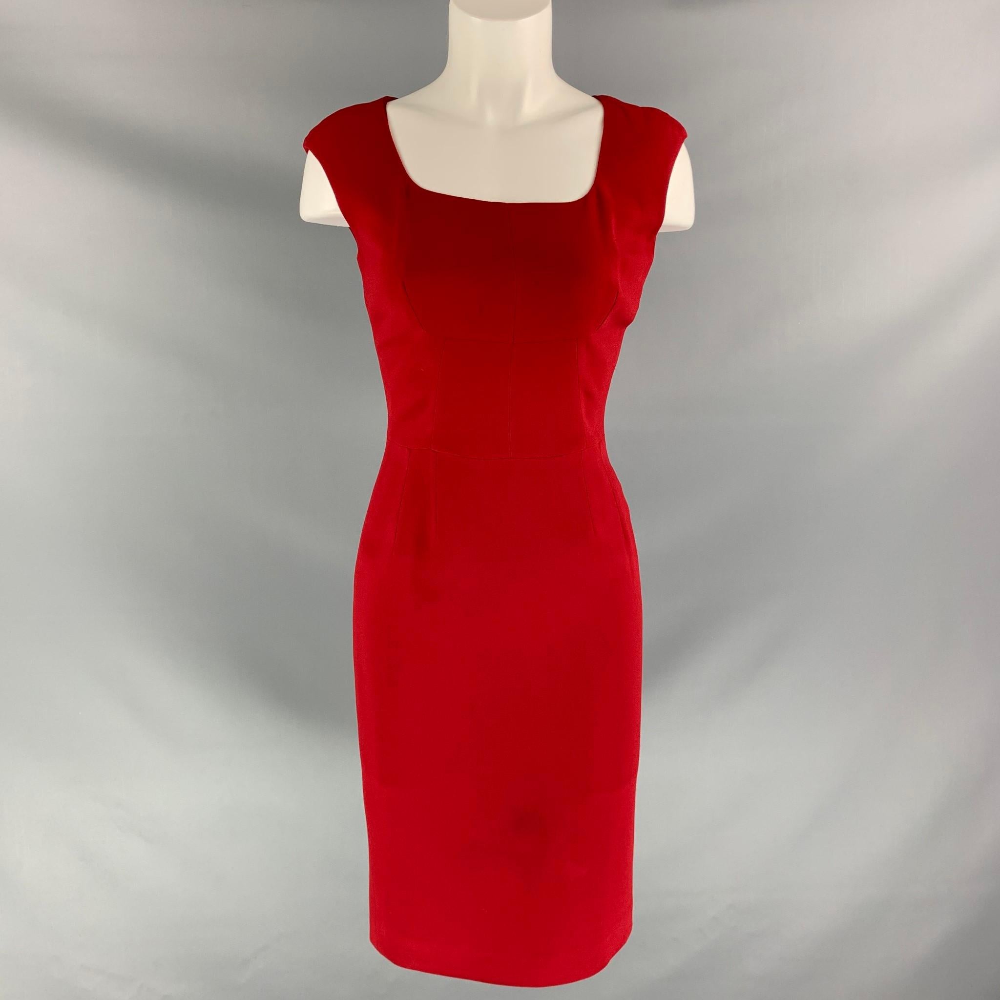 DOLCE & GABBANA mid-calf dress comes in red viscose blend fabric, full zip closure at back, satin lined and scoop neck.

Fair Pre-Owned Condition. Moderate marks and discoloration at bottom, near to neck line and back.
Marked: