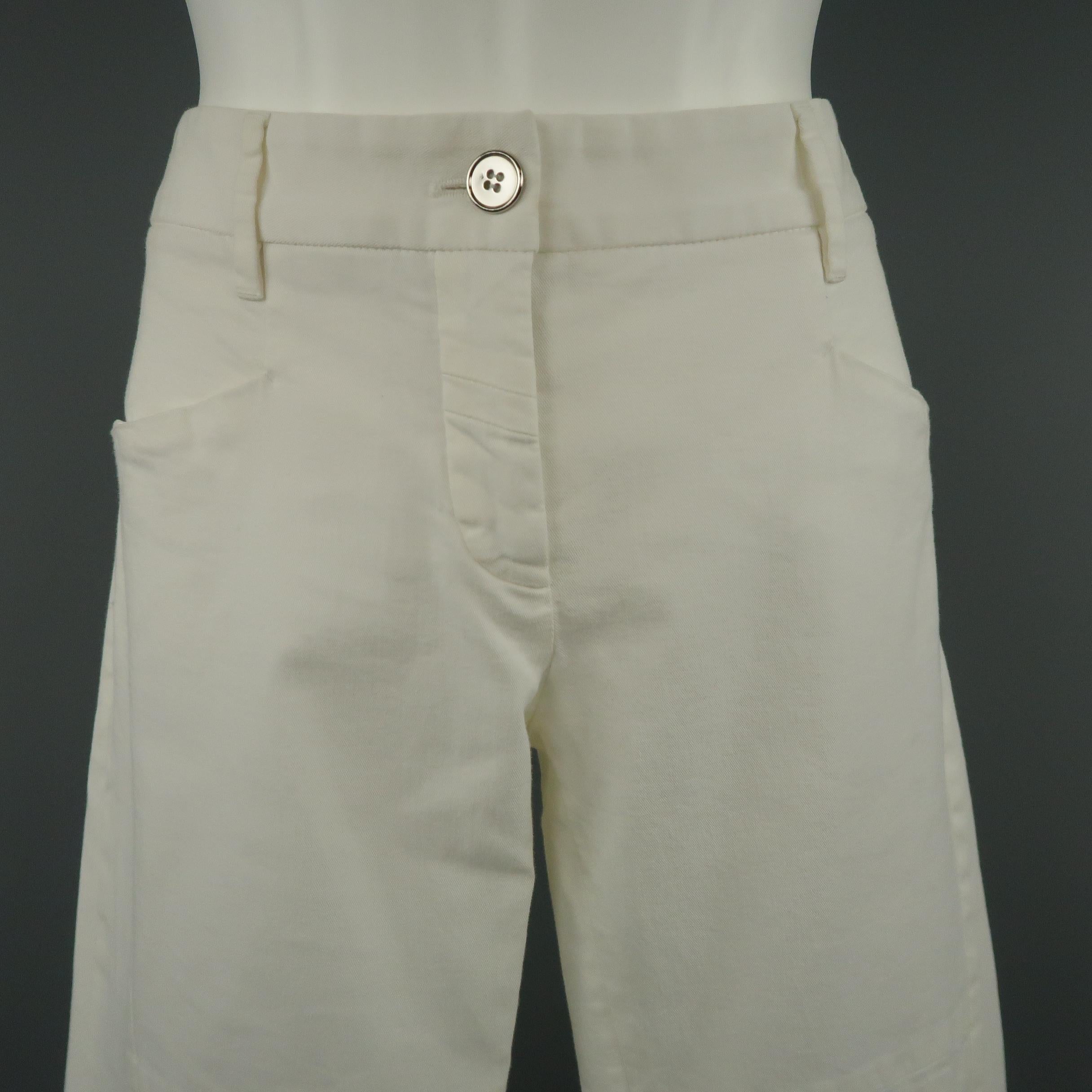 DOLCE & GABBANA skinny pants come in white stretch cotton twill with a metallic silver tone button and biker pant details. Minor wear. Made in Italy.
 
Very Good Pre-Owned Condition.
Marked: IT 42
 
Measurements:
 
Waist: 32 in.
Rise: 8 in.
Inseam: