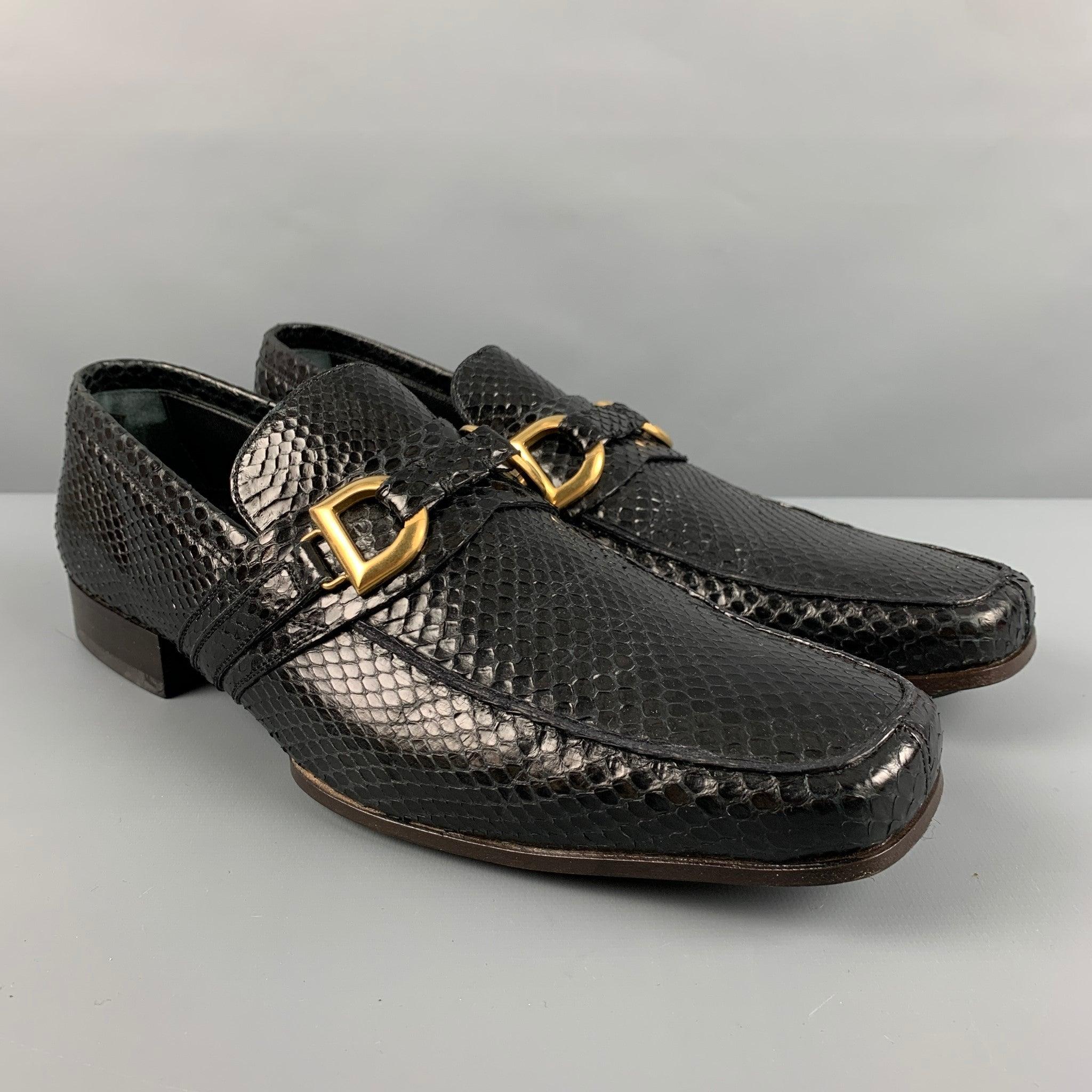 DOLCE & GABBANA loafers comes in a black textured leather featuring a gold tone D &G hardware detail, and a slip on style. Made in Italy.Very Good Pre-Owned Condition. Minor signs of wear. 

Marked:   1303 8070 6Outsole: 11.5 inches  x 4 inches 
  
