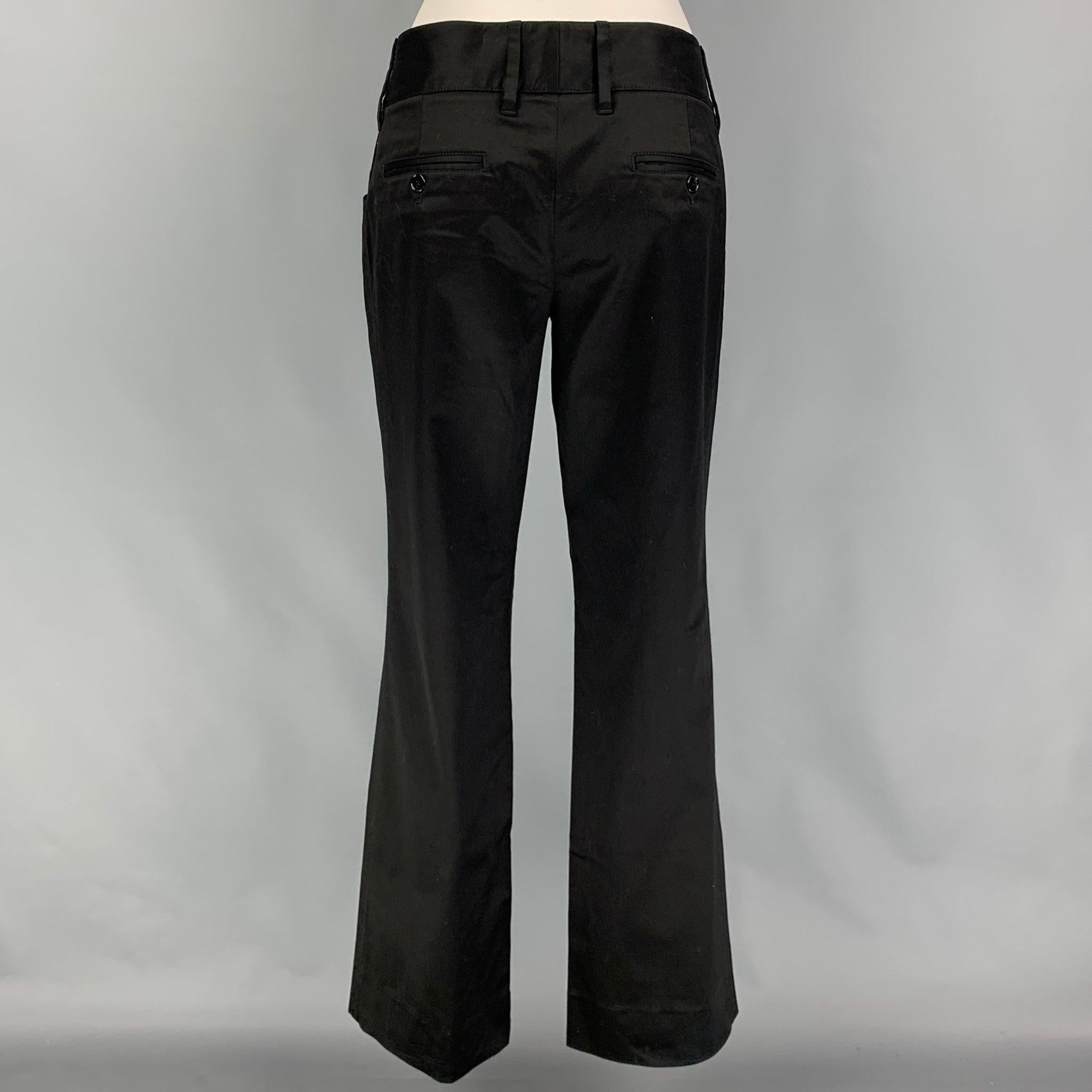 DOLCE & GABBANA dress pants comes in a black cotton blend featuring a low rise, logo emblem, and a zip fly closure. Made in Italy.
 Very Good
 Pre-Owned Condition. 
 

 Marked:  44 
 

 Measurements: 
  Waist: 34 inches Rise: 8.5 inches Inseam: 32