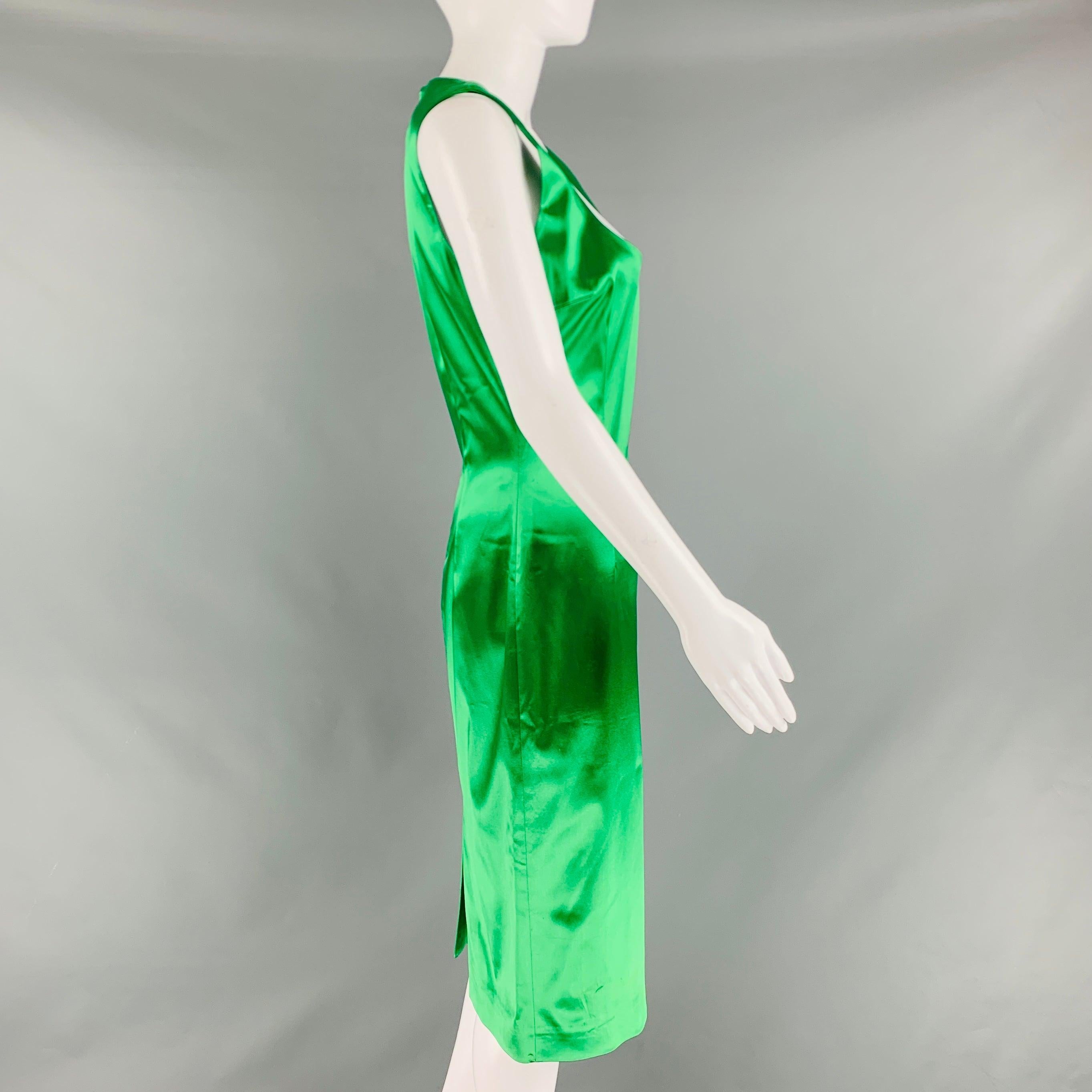 DOLCE & GABBANA cocktail dress comes in an emerald green acetate blend with an animal print interior featuring, back slit, sleeveless, and a back zip up closure. Made in Italy.Very Good Pre-Owned Condition. Moderate piling. 

Marked:   44