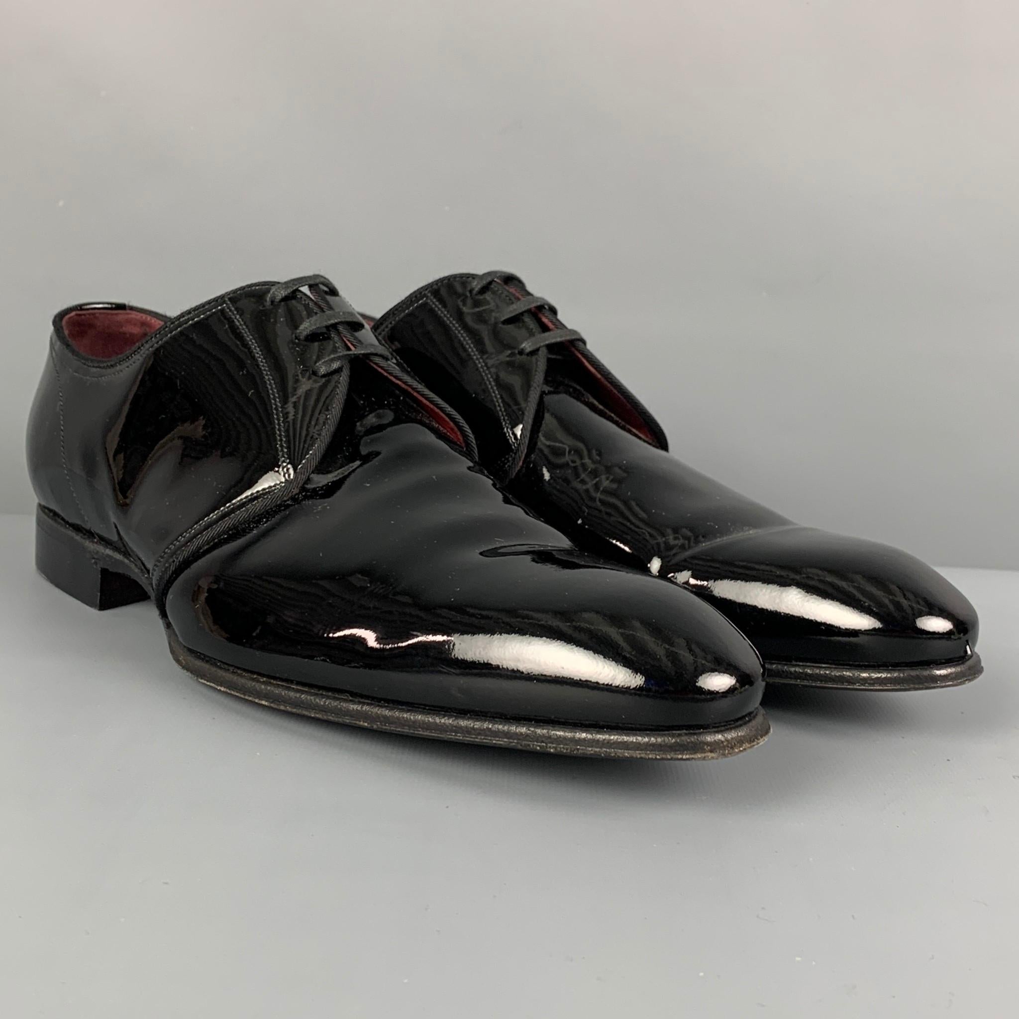 DOLCE & GABBANA shoes comes in a black patent leather featuring a classic style and a lace up closure. Made in Italy. 

Very Good Pre-Owned Condition.
Marked: CA5813 8

Outsole: 12 in. x 3.75 in. 