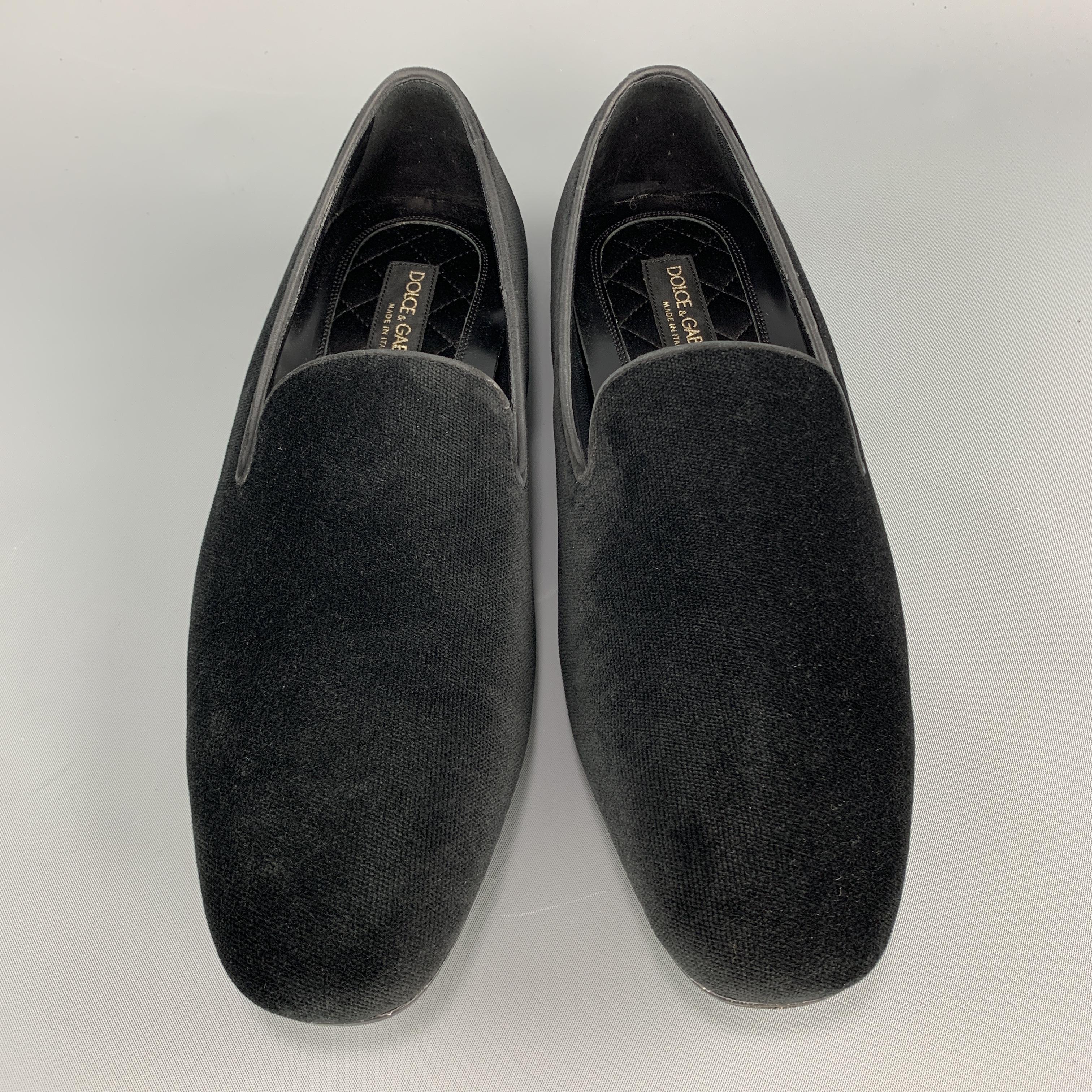 DOLCE & GABBANA tuxedo slippers come in black velvet with a rubber sole and leather piping. Made in Italy.

Original Retail Price: $595.00

New in Box. 
Marked: UK 8.5

Outsole: 11.75 x 3.75 in.